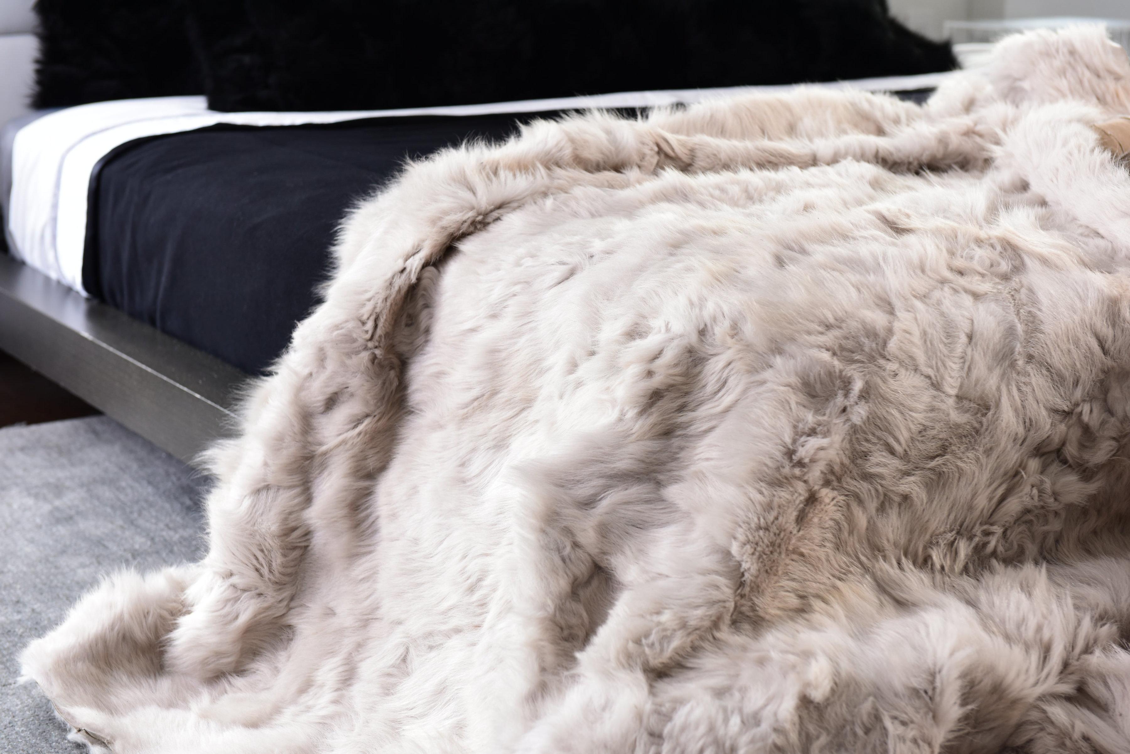 Soft, warm authentic Toscana sheep blanket. 100% Toscana sheep fur from Spain, this one-of-a-kind piece is sewn from Italian glove company remnants. 

Each piece has its own unique character and no two will be exactly alike. We inspect every inch,
