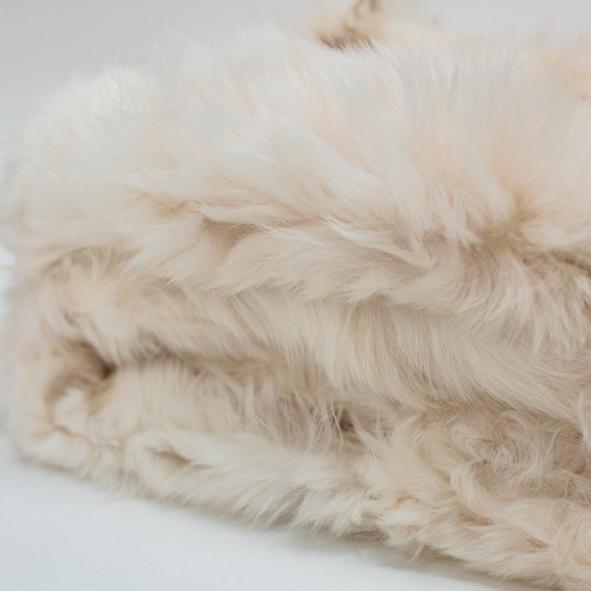 Soft, warm authentic Toscana sheep blanket. 100% Toscana sheep fur from Spain, this one-of-a-kind piece is sewn from Italian glove company remnants. 

Each piece has its own unique character and no two will be exactly alike. We inspect every inch,