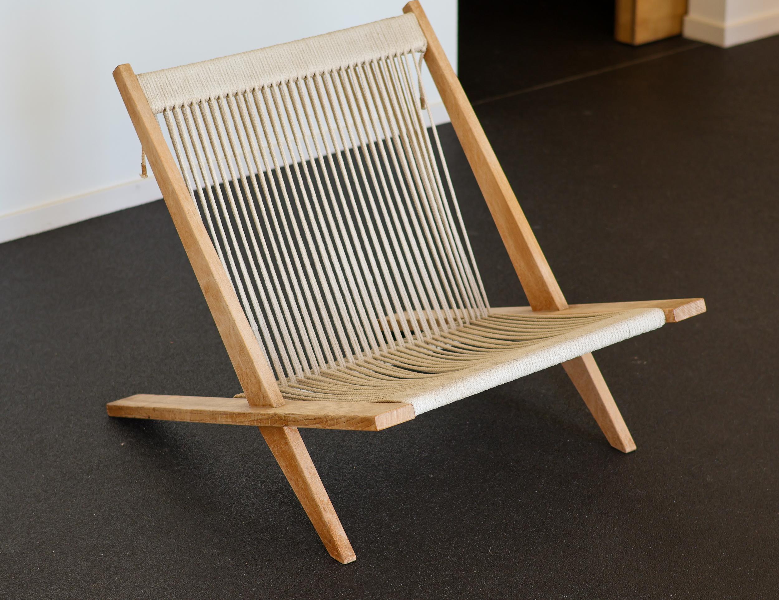 Rare easy chair JH 106 in ash with the original patinated flag halyard. 
Designed by Poul Kjærholm & Jørgen Høj in 1952. 
Manufactured by Thorald Madsen.
Unrestored all original condition.

This piece is part of an important collection of early