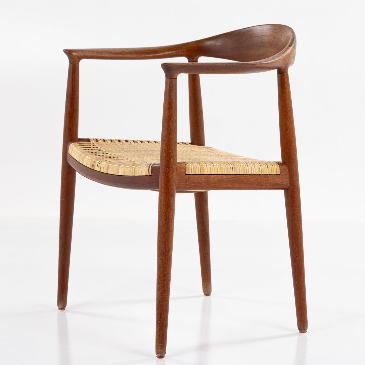 JH 501 - 'The Chair' in solid teak with a newer seat in braided cane. 
Manufactered by Johannes Hansen.
