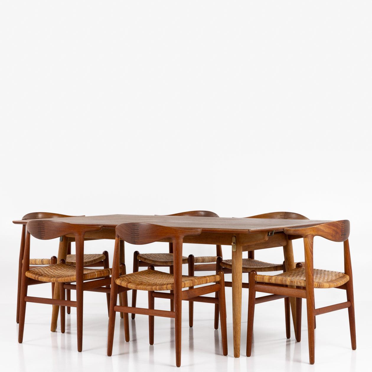 JH 505 - Set of 6 'Cow horn Chairs' in solid teak and patinated braided cane. Designed in 1952.