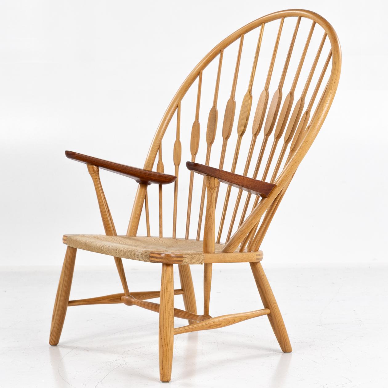 JH 550 - Peacock chair in ash, armrests in teak and seat of braided paper yarn. Architect Hans Wegner for cabinetmaker Johannes Hansen.
