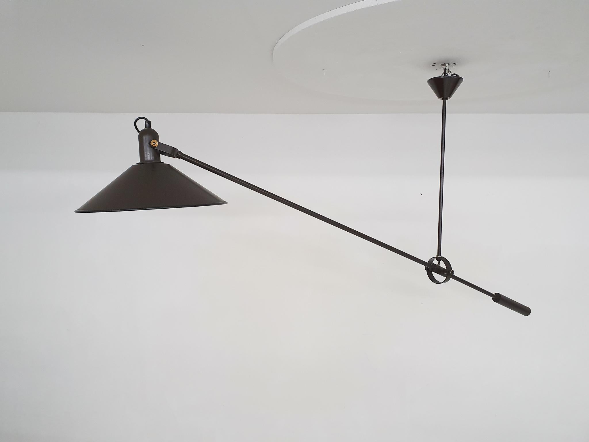 Brown metal counter balance adjustable ceiling light by J.J.M. Hoogervorst for Anvia Almelo, The Netherlands
In good original condition, only the bolts to adjust the lamp have lost the brown paint.

 