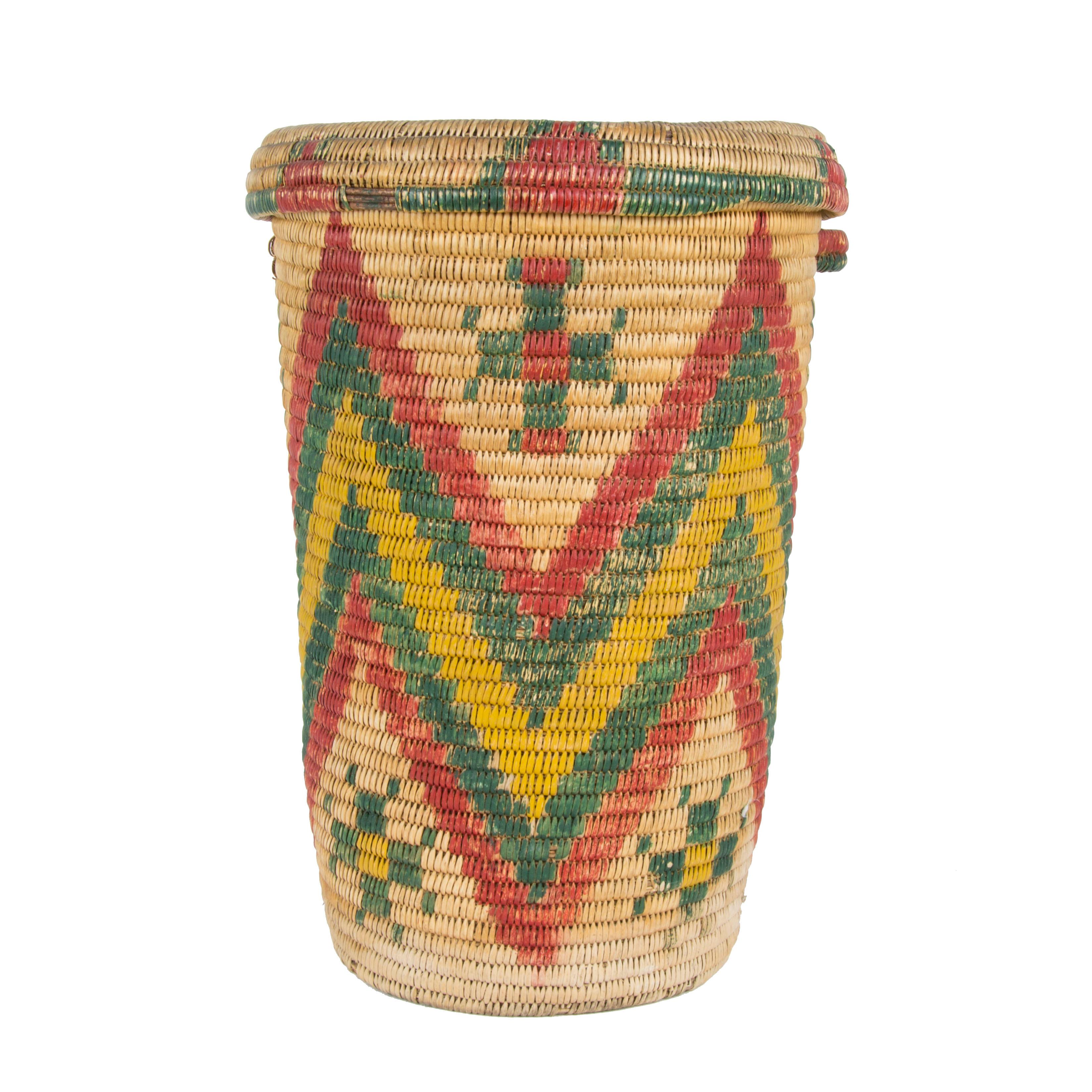 Jicaralla Apache waste basket with handles. Originally dyed willow. As was faded, at a later date est. 1920. Outside was painted to match original. Made in Dulce, NM. Historic and functional.

Period: Last quarter of the 19th century.

Origin: