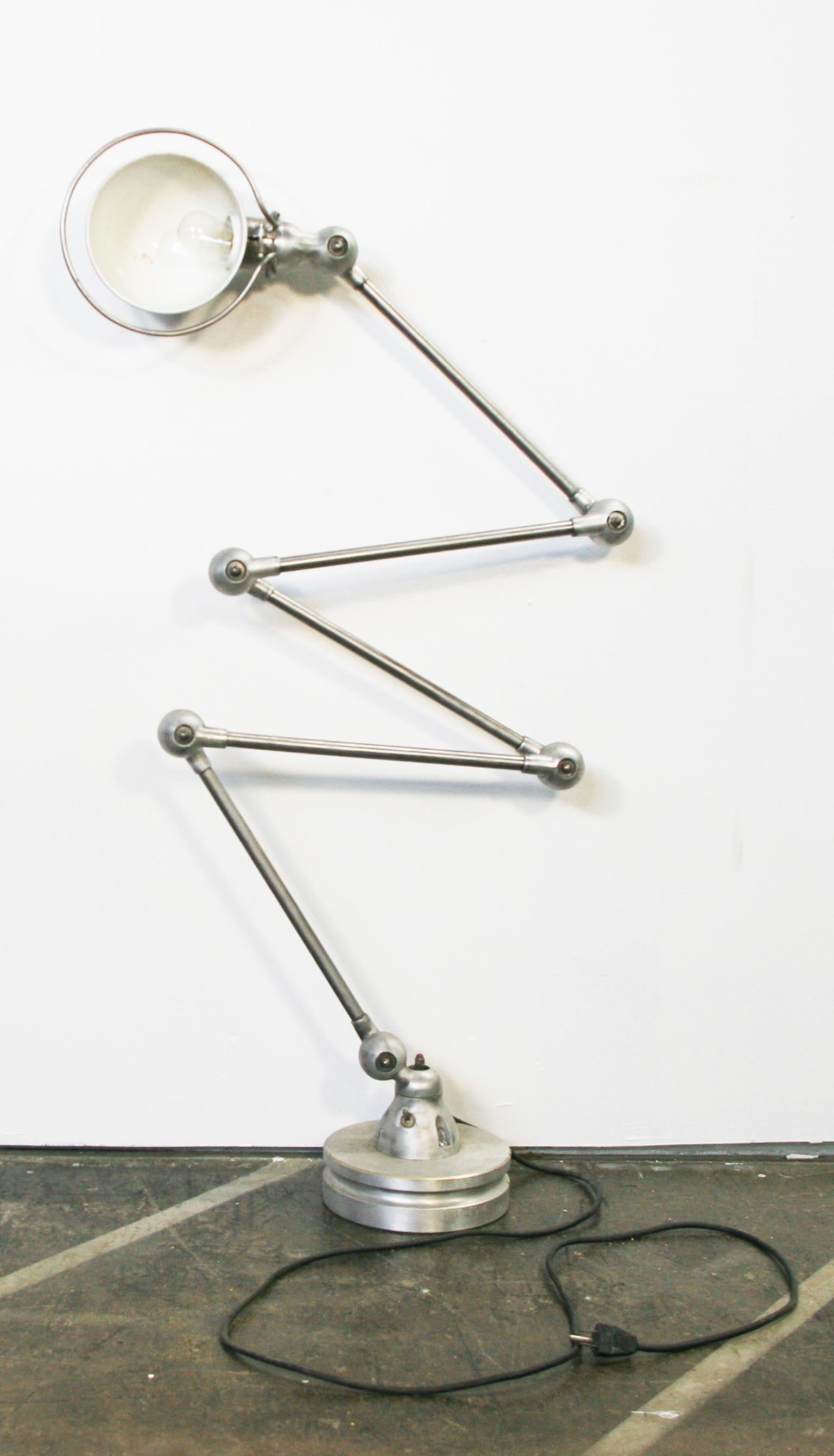 Authentic Jielde French industrial 5-arm floor lamp steel weighted base Adjustable arms with original switch. Designed by Jean-Louis Domecq. Raw steel finish with patina. Works 100% tested. Each arm is adjustable as well as the head of the lamp with