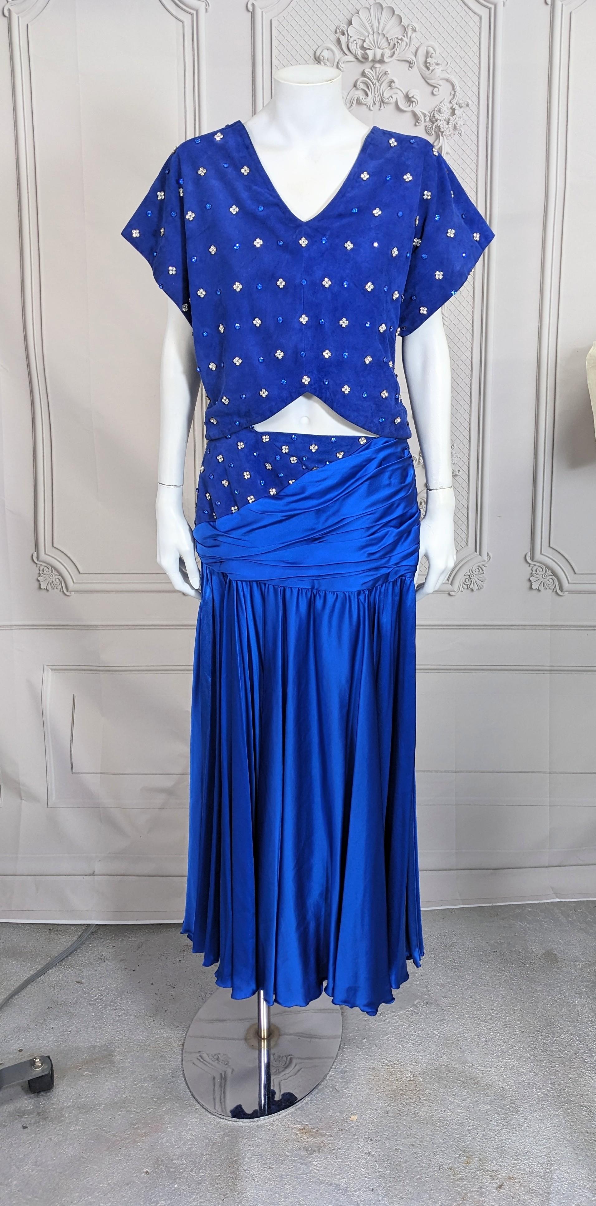 Extravagant Jiki, Monaco Studded Suede and Satin Ensemble from the 1990's. Royal blue suede cropped top set with pave rhinestones in crystal and blue. Matching skirt has a matching studded suede yoke draped with satin and full circle skirt. Pieces