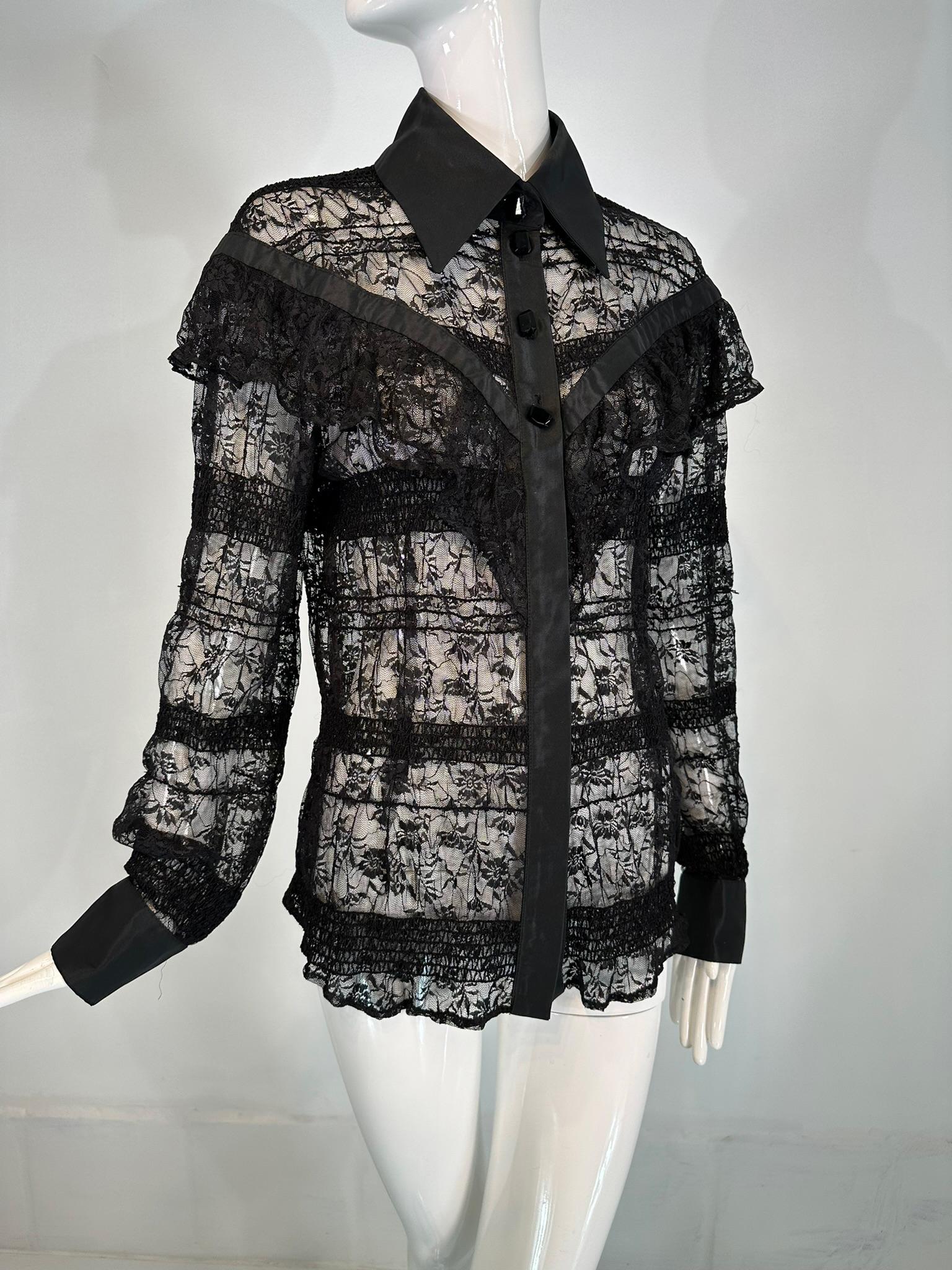Jiki Monte Carlo creations black sheer lace with scattered sequins throughout,  long sleeve blouse with a ruffle lace shoulder yoke front & back. Black satin collar & cuffs with emerald shape black glass buttons, there are small hidden buttons from