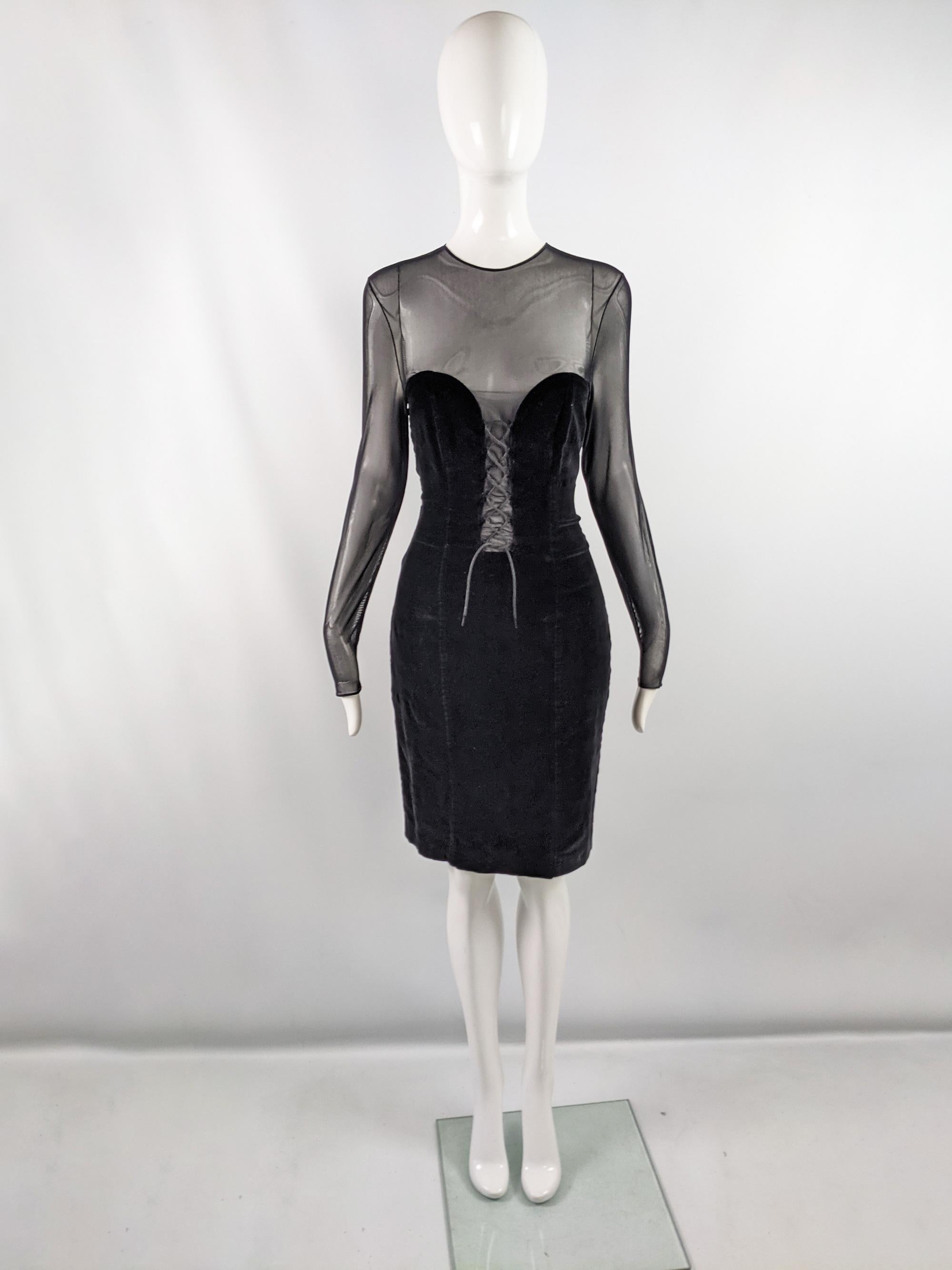 An ultra sexy vintage womens long sleeve party dress from the 90s by luxury French designer, Jiki of Monte Carlo. Made in France, in a black velvet fabric with a sheer mesh sleeves and cut out down the front for a super deep plunge neckline down to