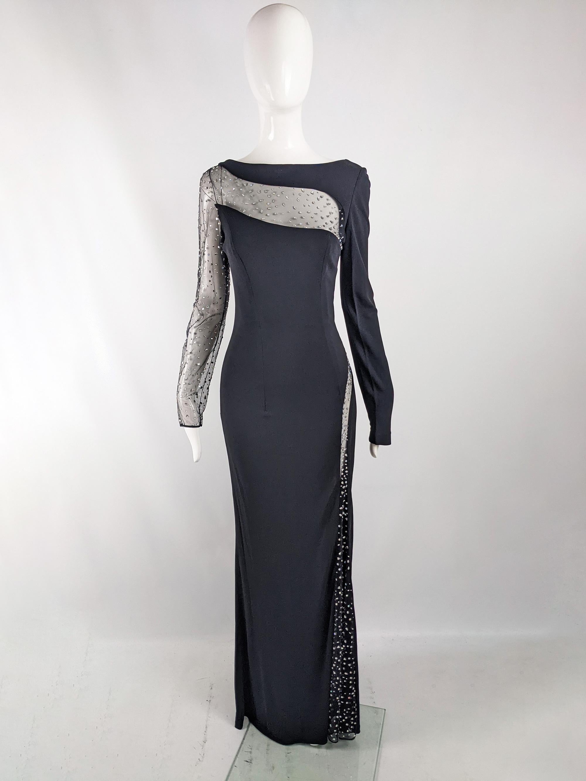 A breathtakingly sexy vintage womens evening gown from the late 80s / early 90s by luxury Monaco-based fashion house, Jiki of Monte Carlo. In a black jersey with scandalous, racy cut outs across the hip, down one leg and across the back towards the