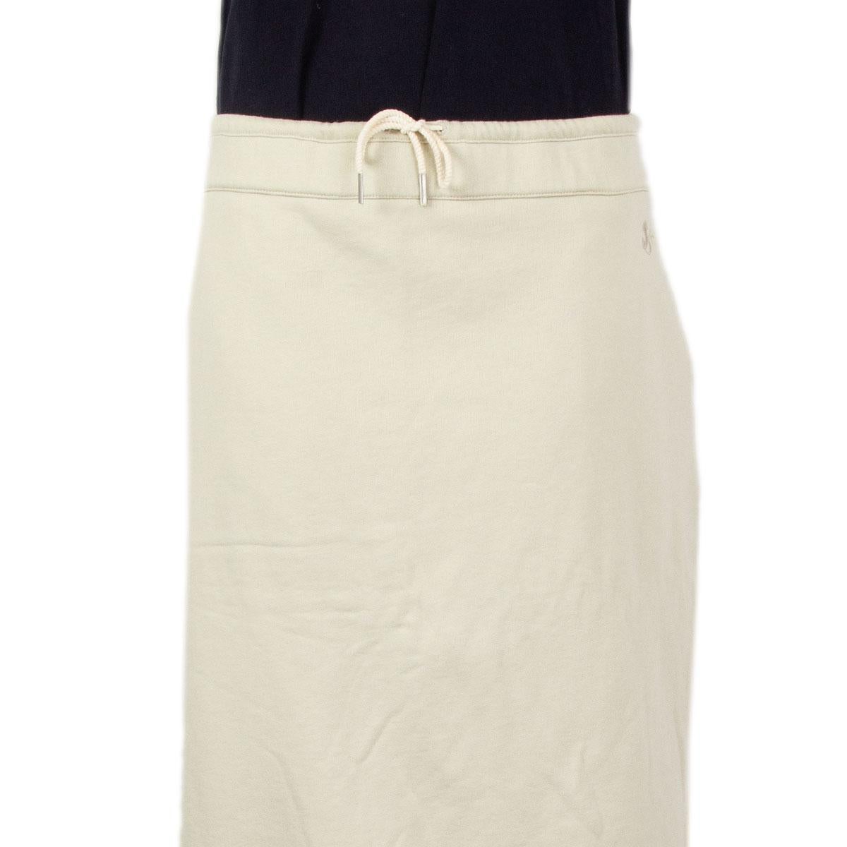 100% authentic Jil Sander jersey skirt in beige cotton (100%) with drawstring at the waist. Comes in a straight cut, two side pocktes, and two side slits. Has been worn and is in excellent condition. Comes with a matching sweater.

Measurements
Tag