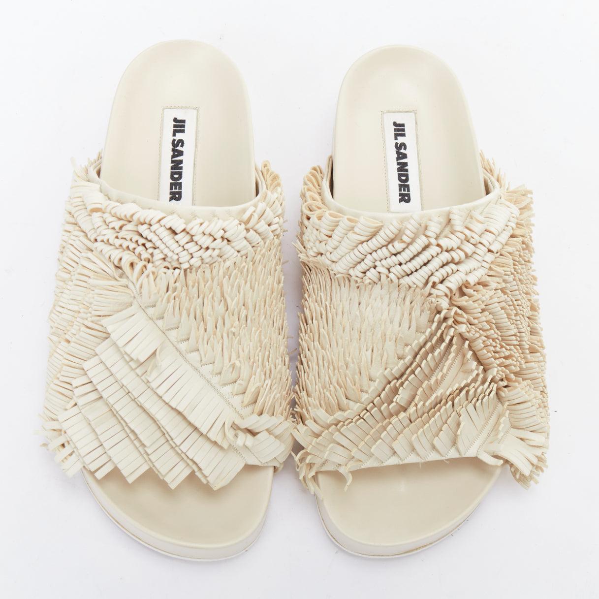 JIL SANDER beige leather fringe platform slides sandals EU38
Reference: LNKO/A02465
Brand: Jil Sander
Material: Leather
Color: Cream
Pattern: Solid
Closure: Slip On
Lining: Cream Leather
Made in: Italy

CONDITION:
Condition: Excellent, this item was