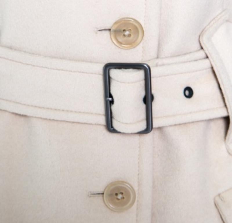 A perfect choice to make a fashion statement, this beige coat from Jil Sander is sure to set hearts racing with its fabulous design and style. The coat is made of wool and angora and features a collared neckline, front button fastenings and a