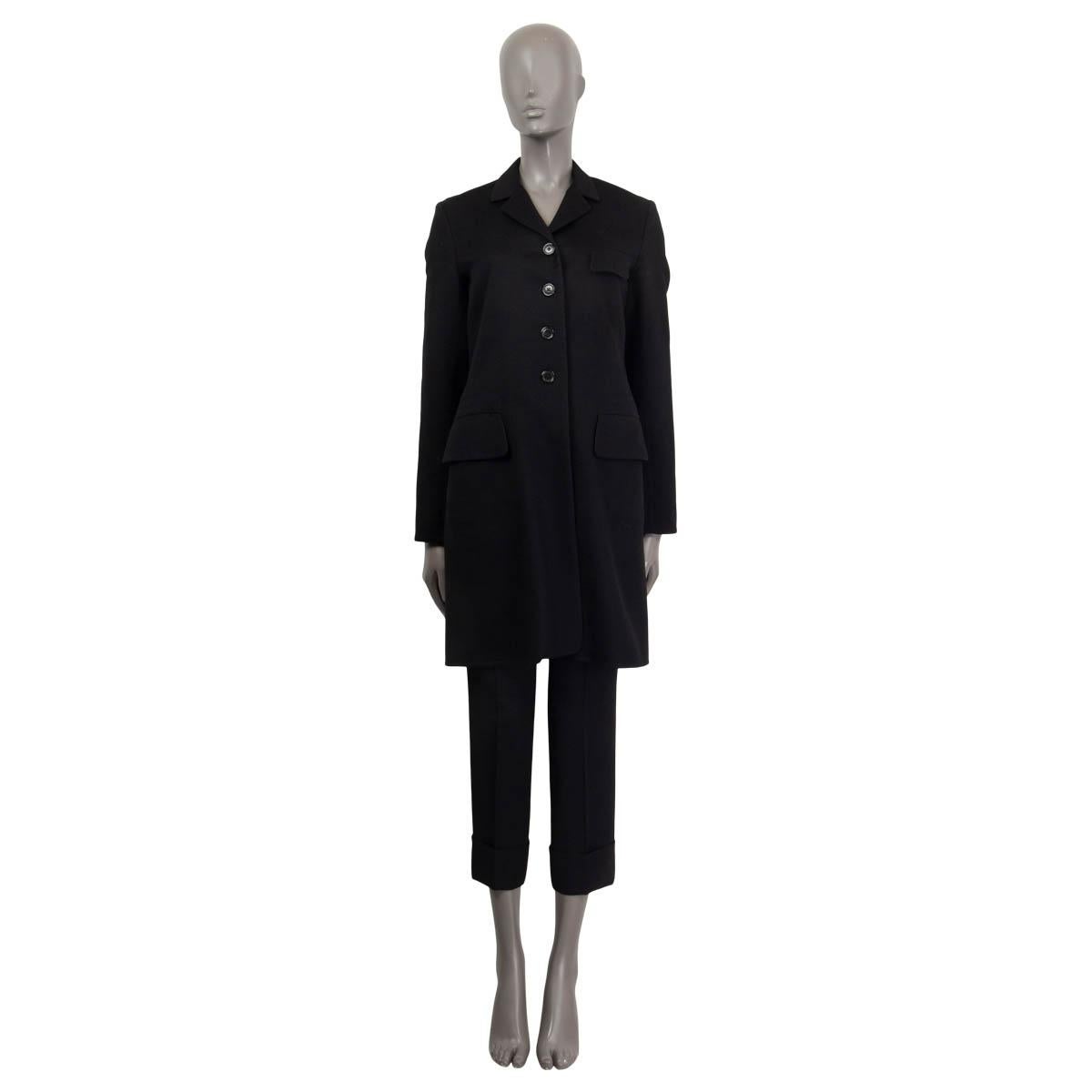 100% authentic Jil Sander single-breasted between seasons coat in black cashmere (100%). Features three flap pockets on the front and a slit on the back. Has a detachable black vest in black polyamide (100%). Opens with four buttons on the front.