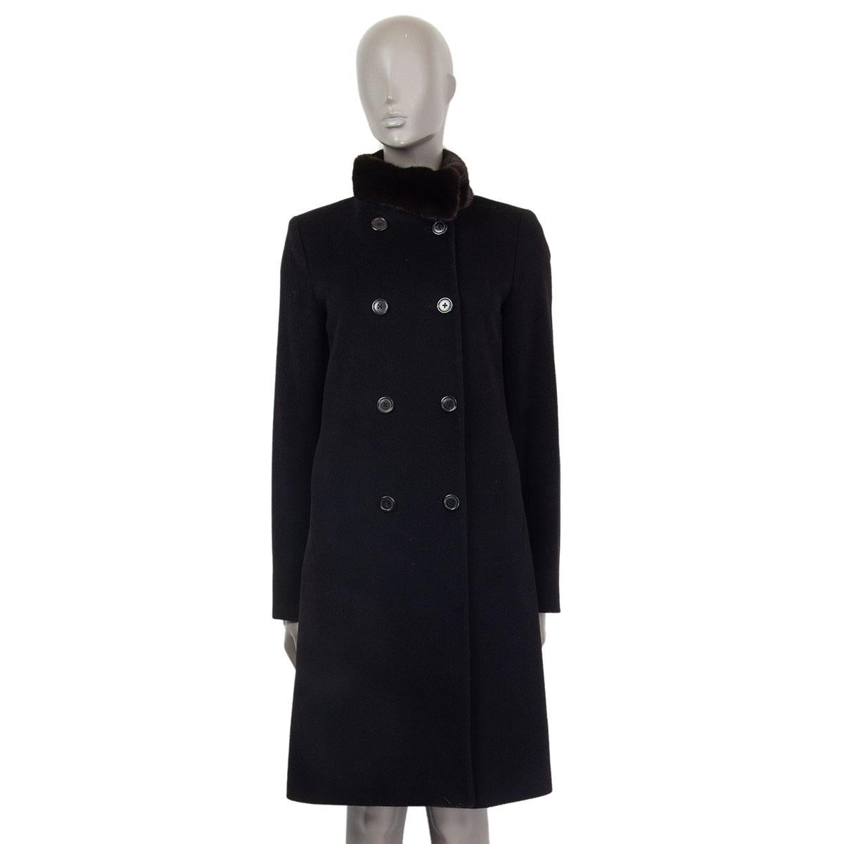 Jil Sander double breasted bend collar coat in black cashmere (100%) and brown natural mink fur (100%) detail on the neck. Closes with buttons on the front and has slit pockets. Lined in black silk (100%). Has been worn and is in excellent