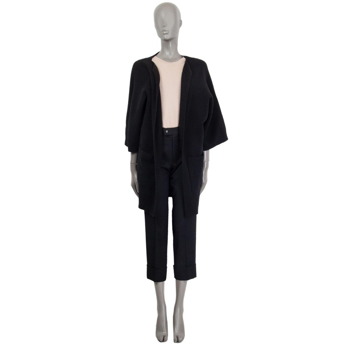100% authentic Jil Sander oversized open cardigan with wide 3/4 raglan sleeves and two patch pockets at front in black cashmere (95%) and elastane (5%). Has been worn and is in excellent condition. 

Measurements
Tag Size	36
Size	S
Waist From	110cm