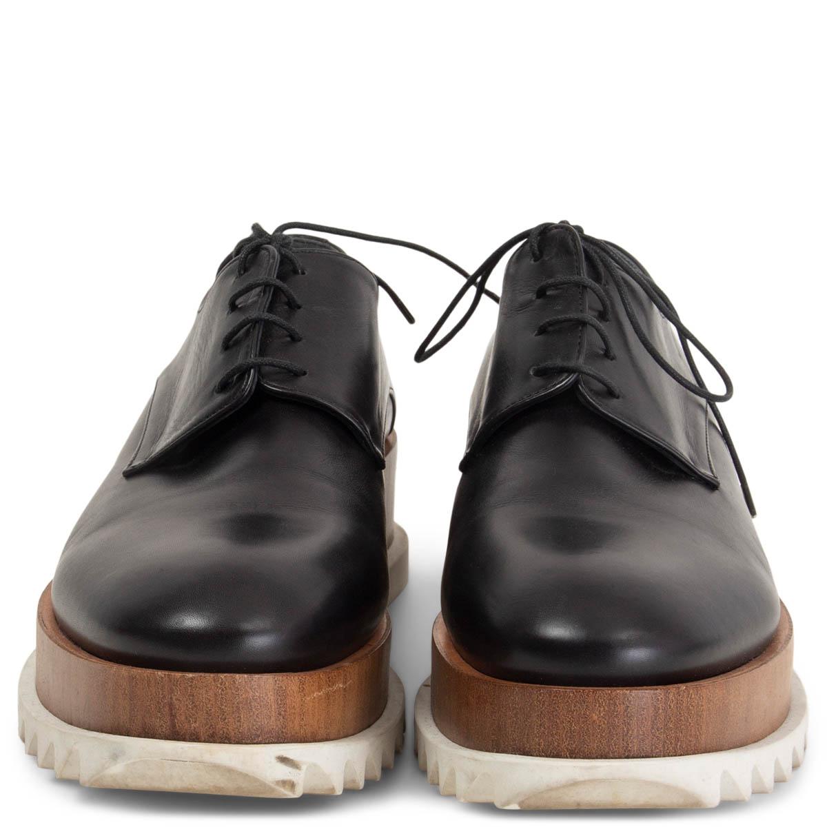 100% authentic Jil Sander lace-up derbys featuring a brown wooden platform with and saw-edged white rubber soles. Have been worn and are in excellent condition. 

Measurements
Imprinted Size	38
Shoe Size	38
Inside Sole	25cm (9.8in)
Width	7.5cm