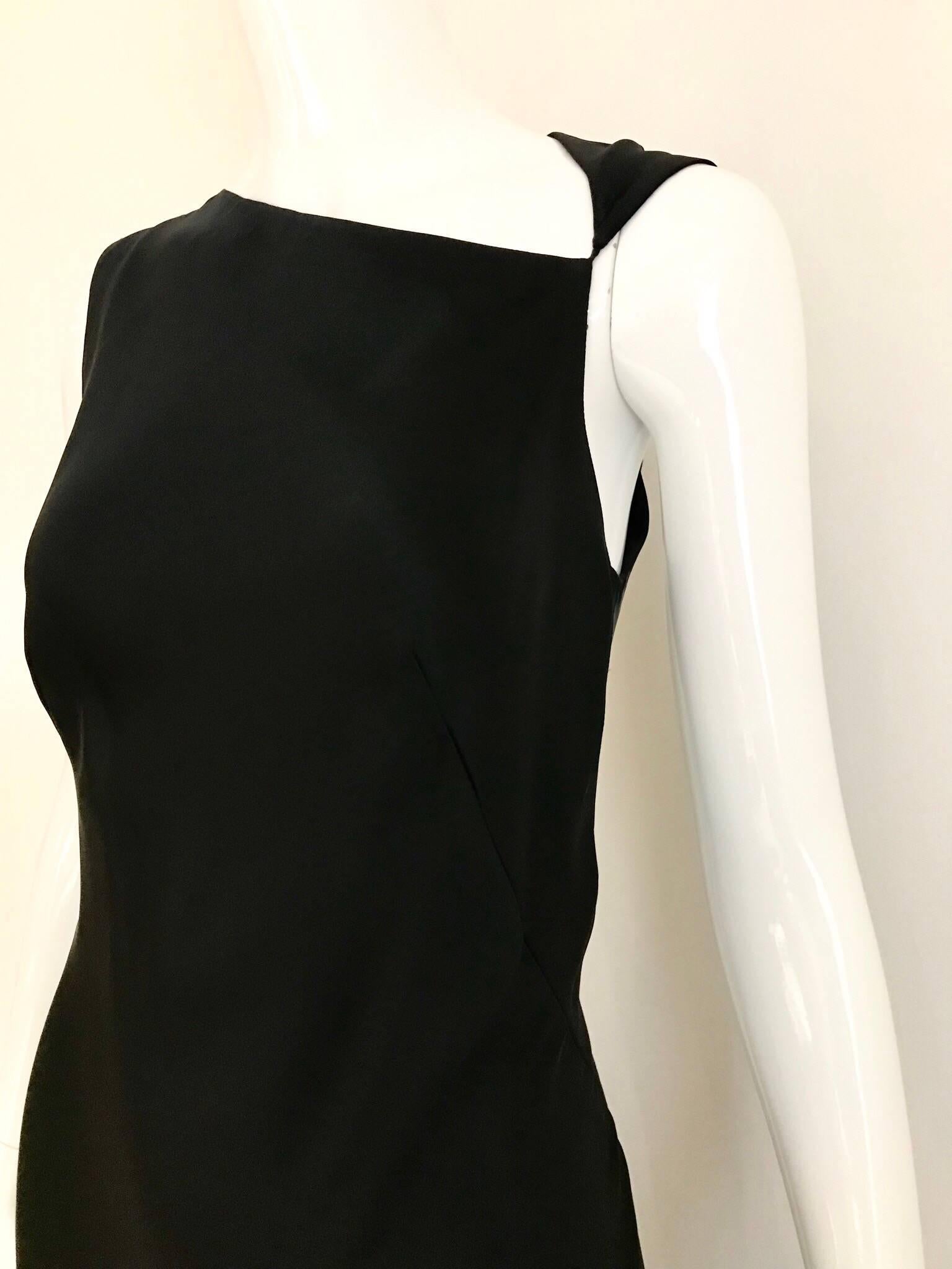 Classic and sexy Jil Sander black silk charmeuse sleeveless bias cut gown with asymetrical neckline. Fit size Small- Medium
