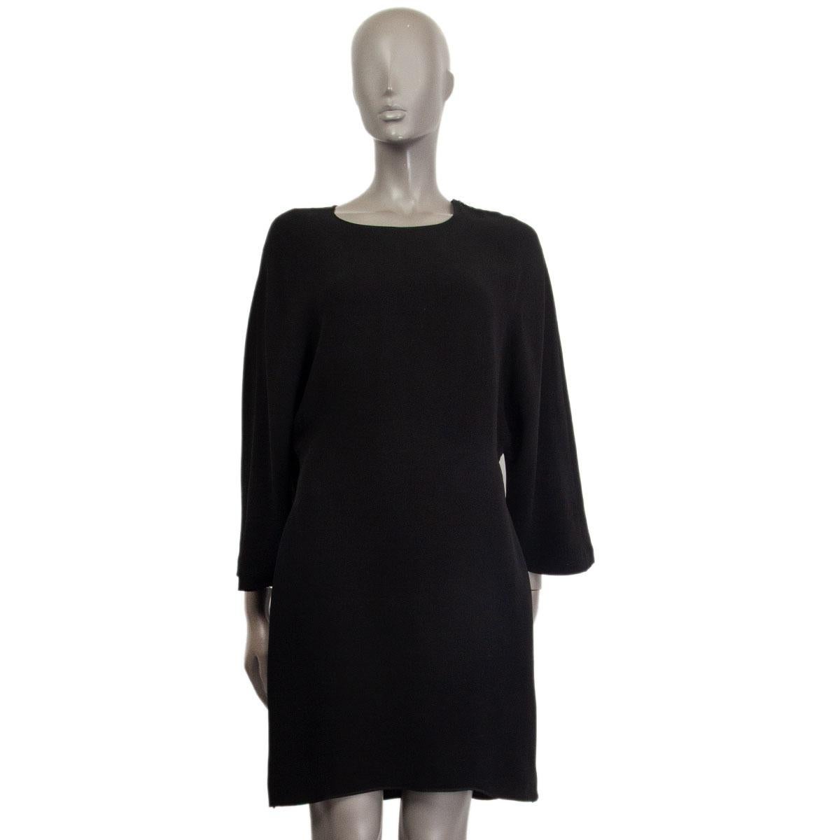 100% authentic Jil Sander dolman-sleeve shift dress in black silk (missing content tag) with round neck-line. Closes with a zipper on the left shoulder and one on the left side. Unlined. Has been worn and is in excellent condition.

Tag Size	Missing