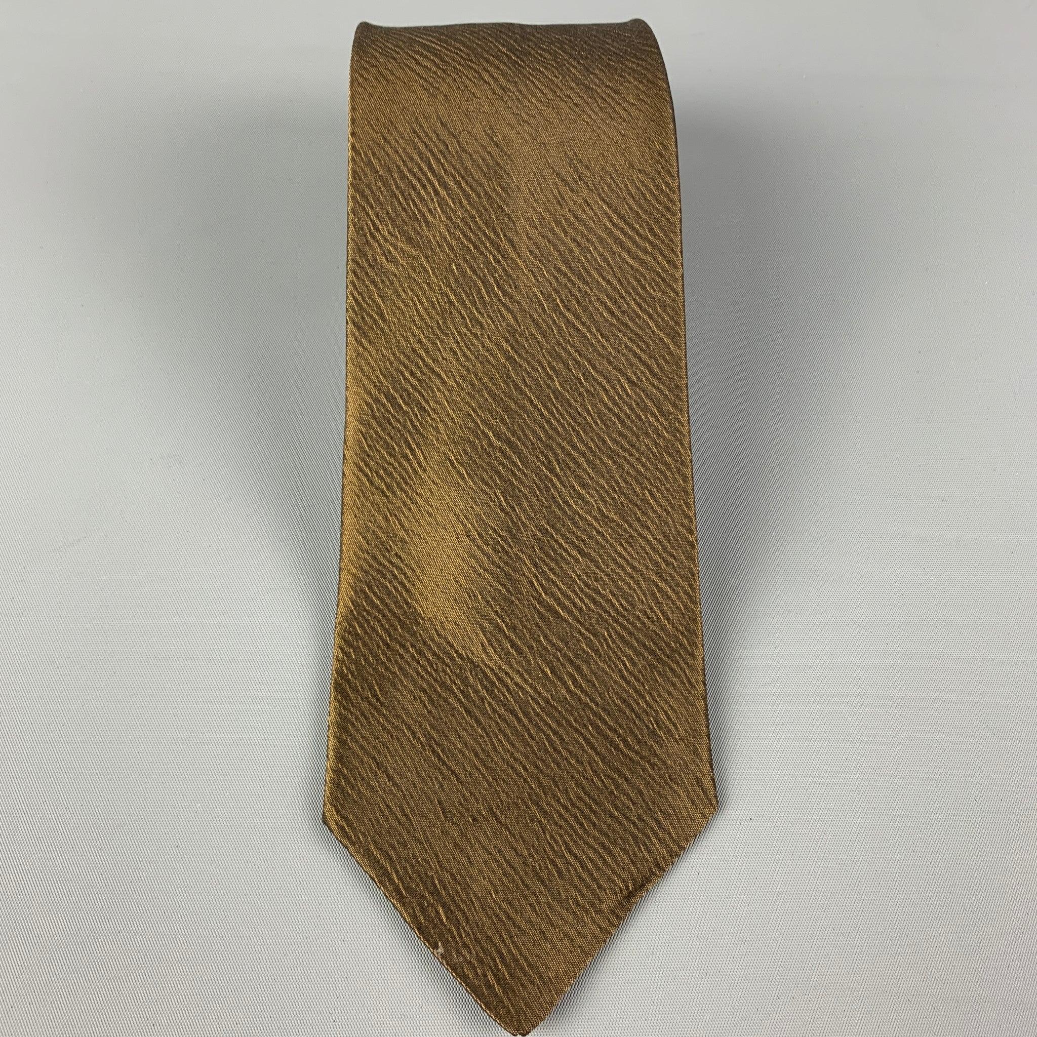 JIL SANDER
necktie comes in a brown silk with a all over textured print. Very Good Pre-Owned Condition. 

Measurements: 
  Width: 3.25 inches  Length: 60 inches 
  
  
 
Reference: 119993
Category: Tie
More Details
    
Brand:  JIL SANDER
Color: 