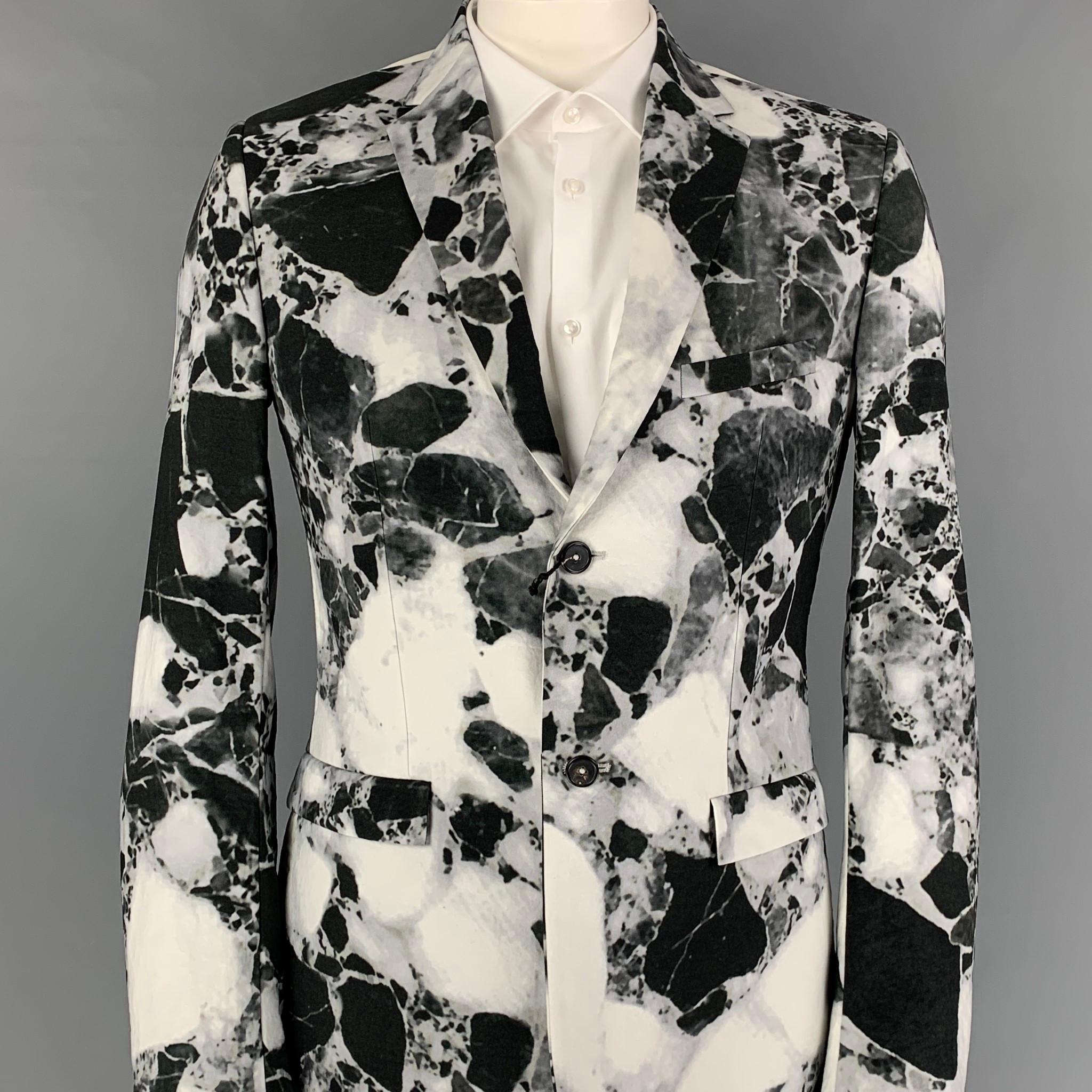 JIL SANDER by RAF SIMONS Fall-Winter 2008 sport coat comes in a black & white marble polyamide with a full liner featuring a notch lapel, flap pockets, and a double button closure. Made in Italy. 

New With Tags.
Marked: 54

Measurements:

Shoulder: