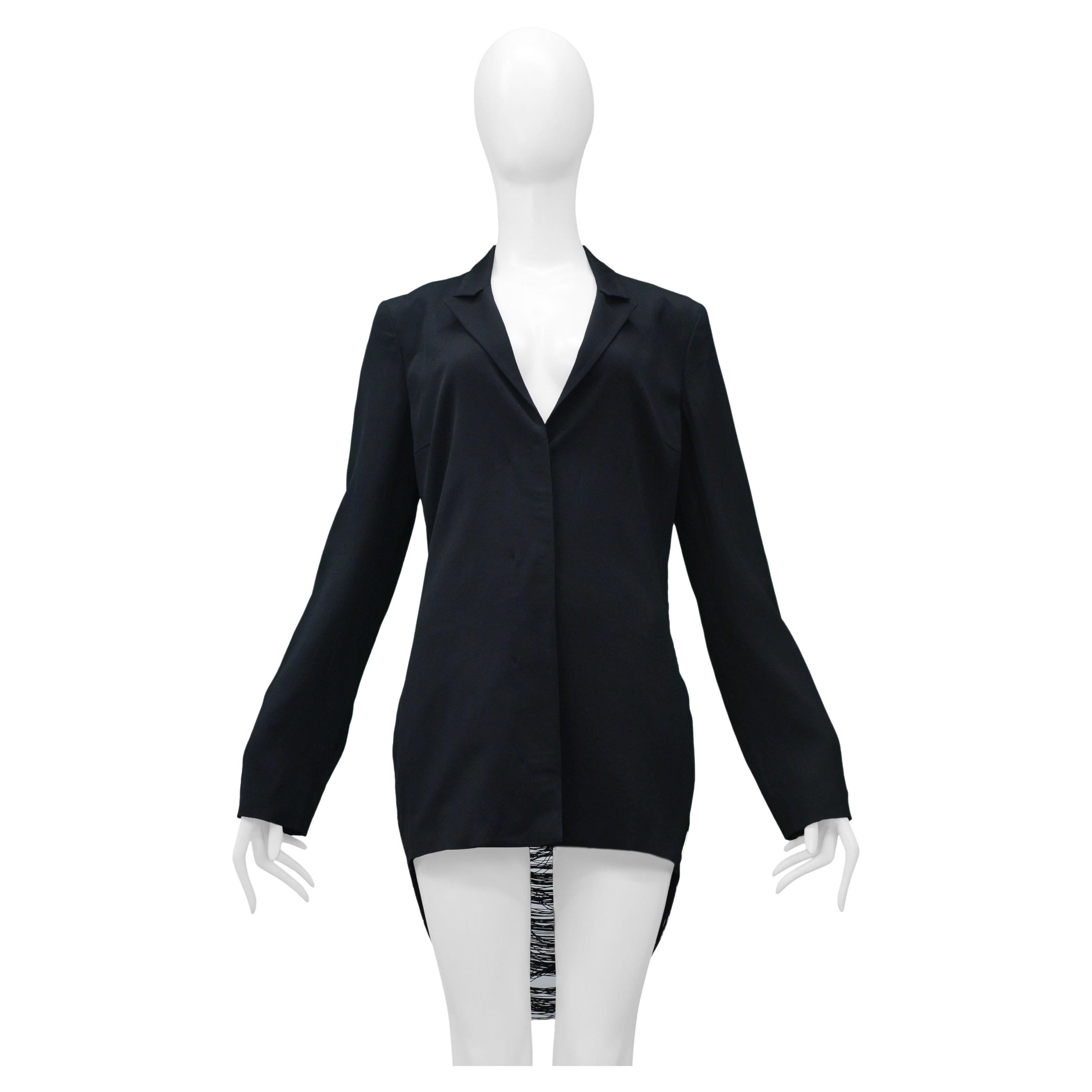 Resurrection Vintage is excited to offer a vintage Jil Sander by Raf Simons navy blazer with hidden button closure, notch collar, and open back with fringe.

Jil Sander Label
Size 36
53% Acetate, 45% Viscose, 2% Spandex
2009 Collection 
Excellent