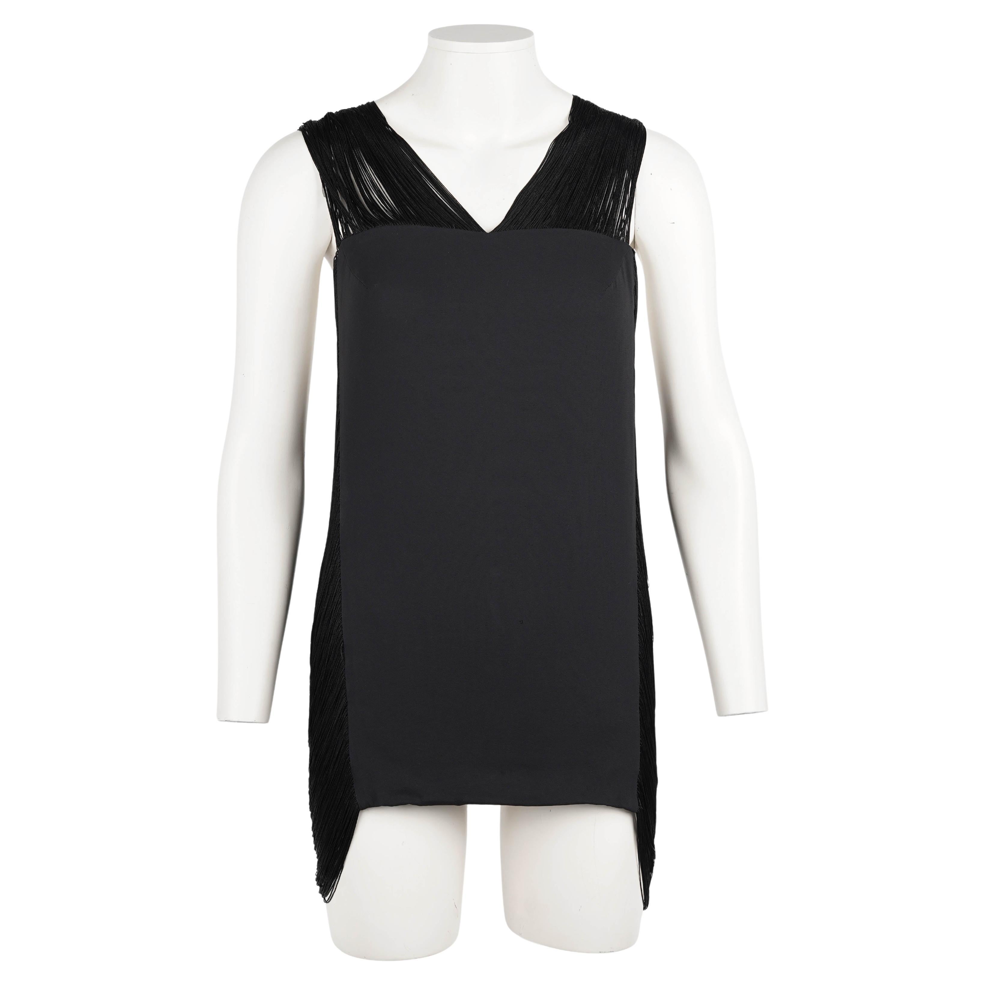A rare and collectible piece from Raf Simons’ Spring/Summer 2009 collection for Jil Sander, this ultra-mini dress or tunic top is a sculptural statement piece inspired by the runway version shown in look 35. The structured matte black front panel