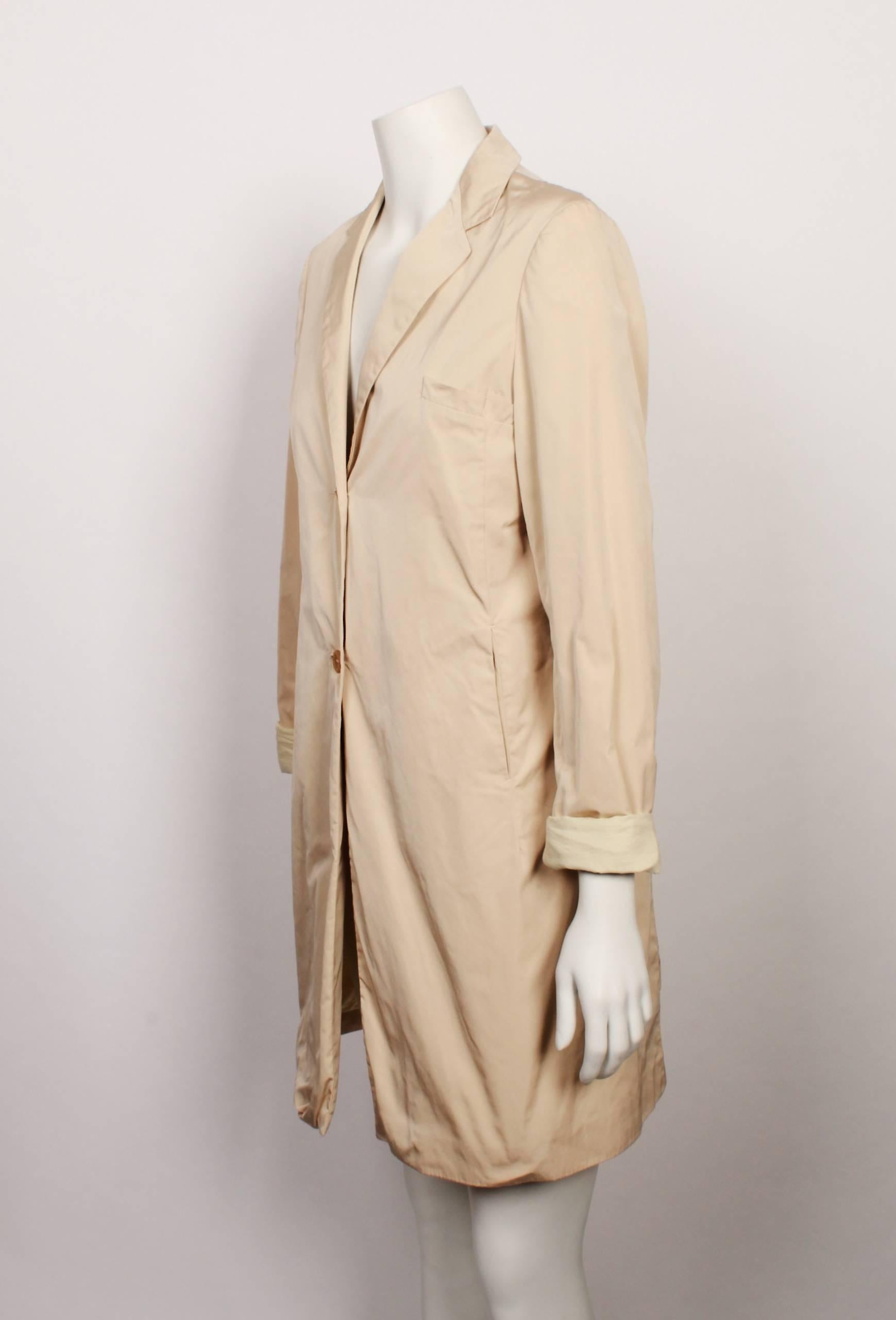 From the house of minimalist German designer Jil Sander. Light-weighted and made in Italy this coat is indicative of the designer's ethos of clean shapes and simple design. 