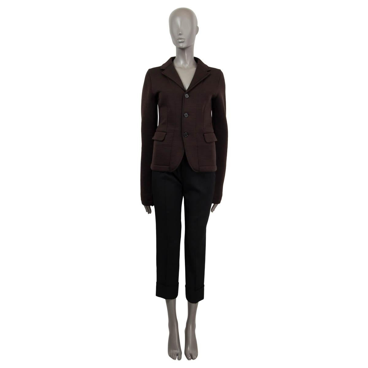 100% authentic Jil Sander blazer in dark brown wool (85%) and polyamide (15%). Features two flap pockets. Opens with three buttons on the front. Lined in cotton (100%). Has been worn and is in excellent condition. 

Measurements
Tag