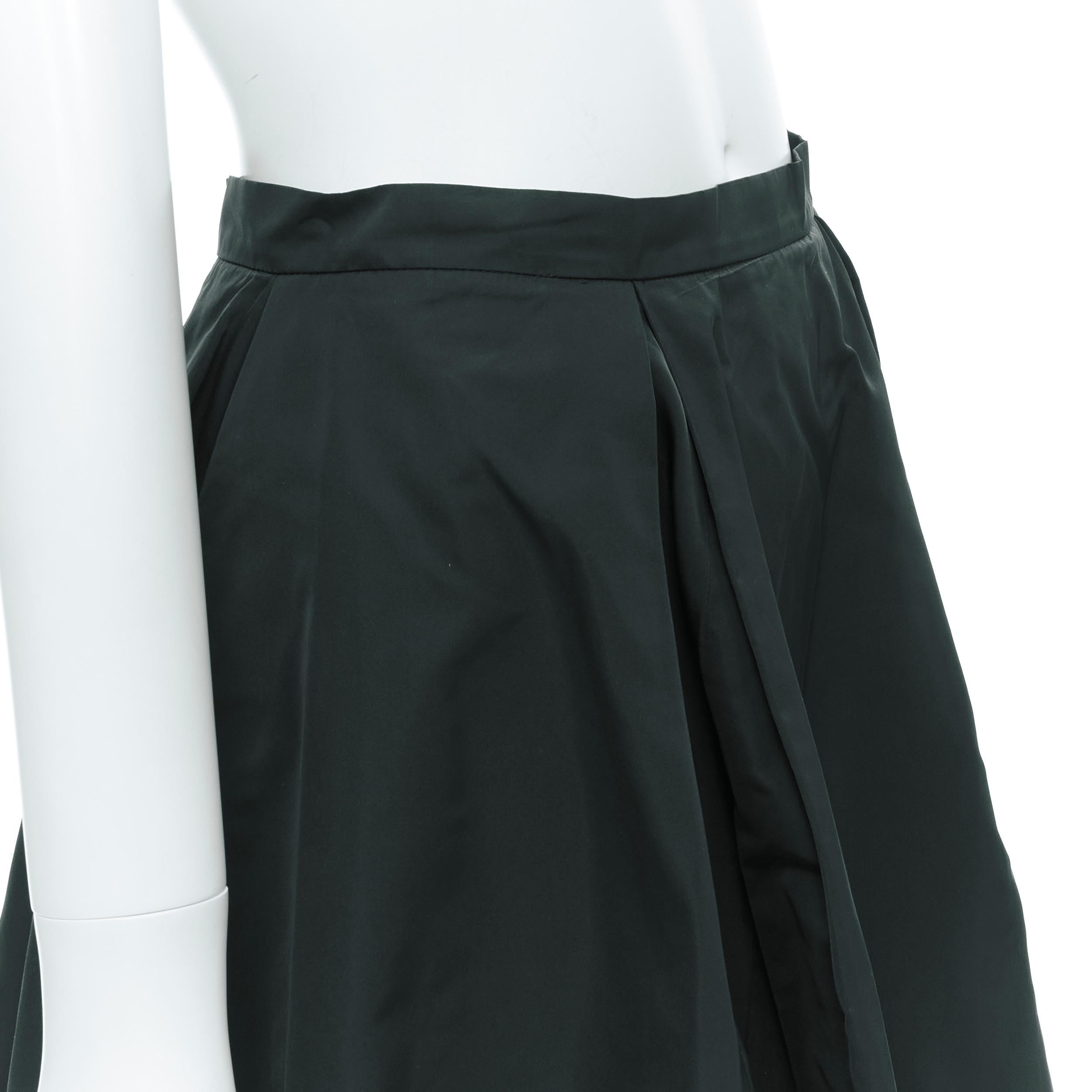 JIL SANDER dark green polyester silk A-line flared skirt FR34 XS 
Reference: LNKO/A01964 
Brand: Jil Sander 
Material: Polyester 
Color: Green 
Pattern: Solid 
Closure: Zip 
Extra Detail: Dual front pleat. Side zip closure. 
Made in: Italy