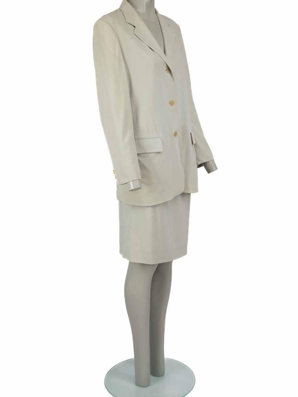 CONDITION is Good. Minor wear to suit is evident. Light pen mark to the centre front of skirt and small pull thread on front waistband. A small rip to back slit on this used Jil Sander designer resale item.
 
 Details
 Grey
 Wool
 Skirt suit set
