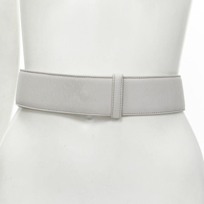 JIL SANDER light grey minimalist wide leather waist belt 75cm
Reference: KEDG/A00180
Brand: Jil Sander
Material: Leather
Color: Grey
Pattern: Solid
Closure: Pin
Lining:  Leather
Extra Details: Minimalist closure. Concealed pin buckle.
Made in: