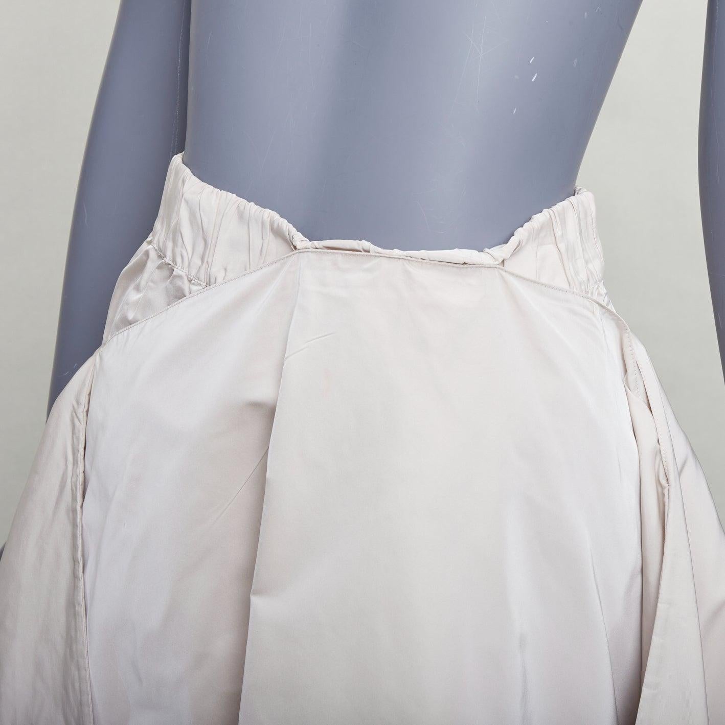 JIL SANDER light grey shiny taffeta 3D deconstructed A-line midi skirt FR34 XS
Reference: LNKO/A02565
Brand: Jil Sander
Material: Polyester, Silk
Color: Grey
Pattern: Solid
Closure: Elasticated
Made in: Italy

CONDITION:
Condition: Very good, this