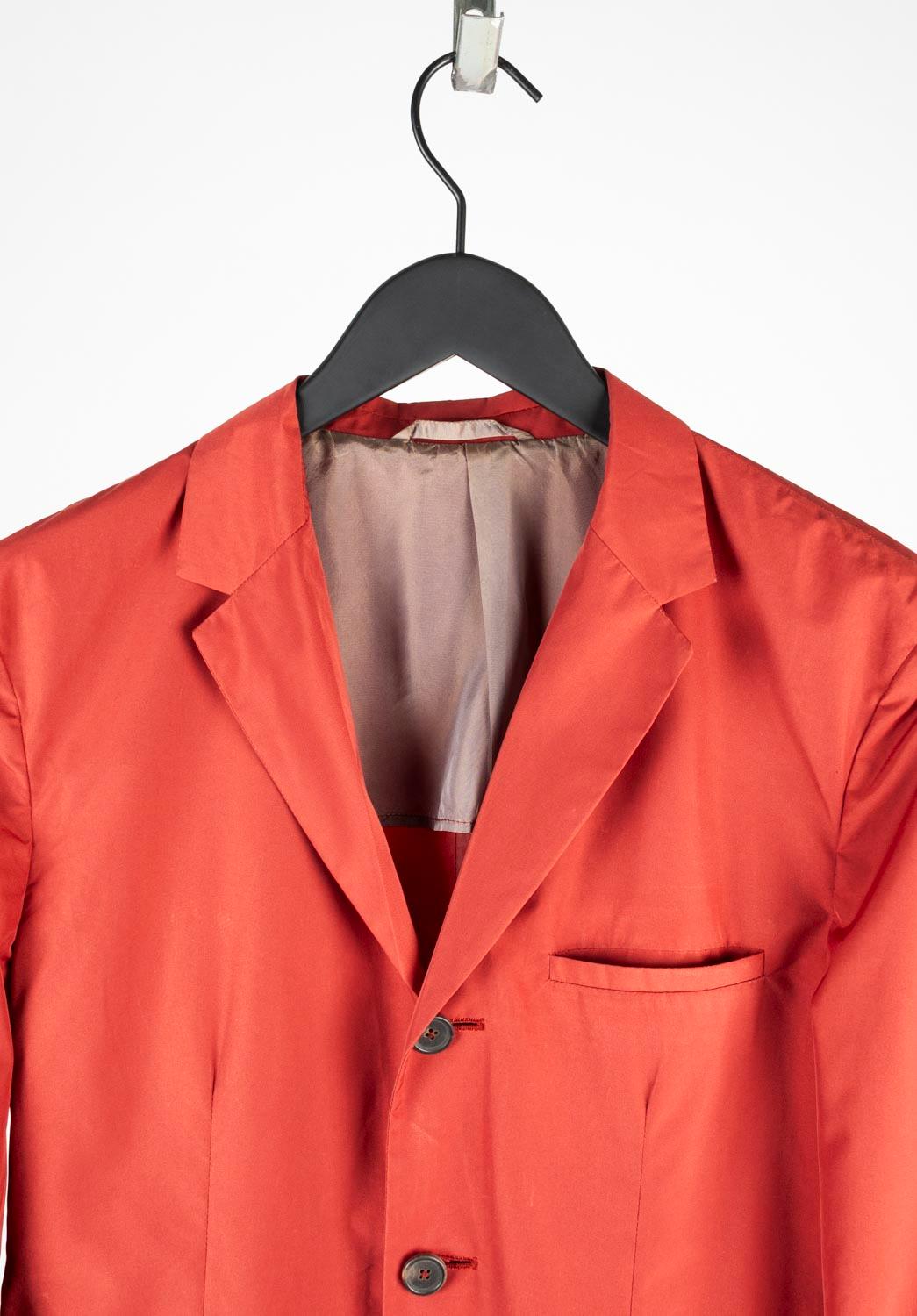 100% genuine Jil Sander Light Blazer, S663 
Color: off red/brick
(An actual color may a bit vary due to individual computer screen interpretation)
Material: 100% polyester/nylon (label washed out after dry cleaning
Tag size: ITA48 (Medium)
This