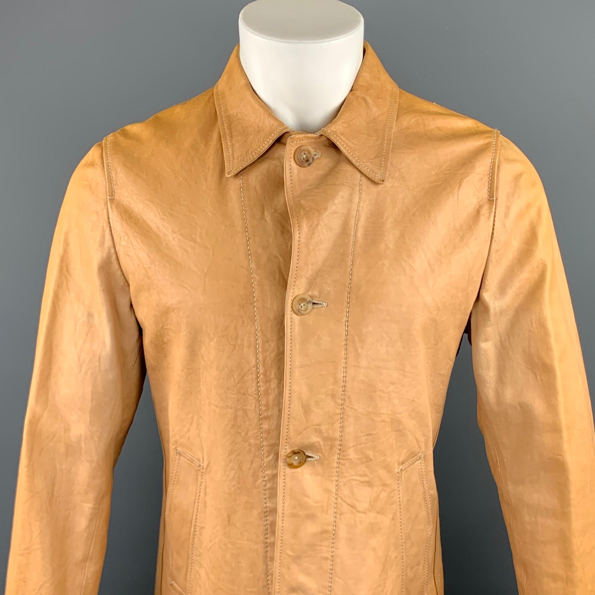 JIL SANDER jacket comes in a tan distressed leather featuring a drawstring, contrast stitching, spread collar, and a buttoned closure. Made in Italy.

Very Good Pre-Owned Condition.
Marked: IT 50

Measurements:

Shoulder: 17.5 in. 
Chest: 40 in.