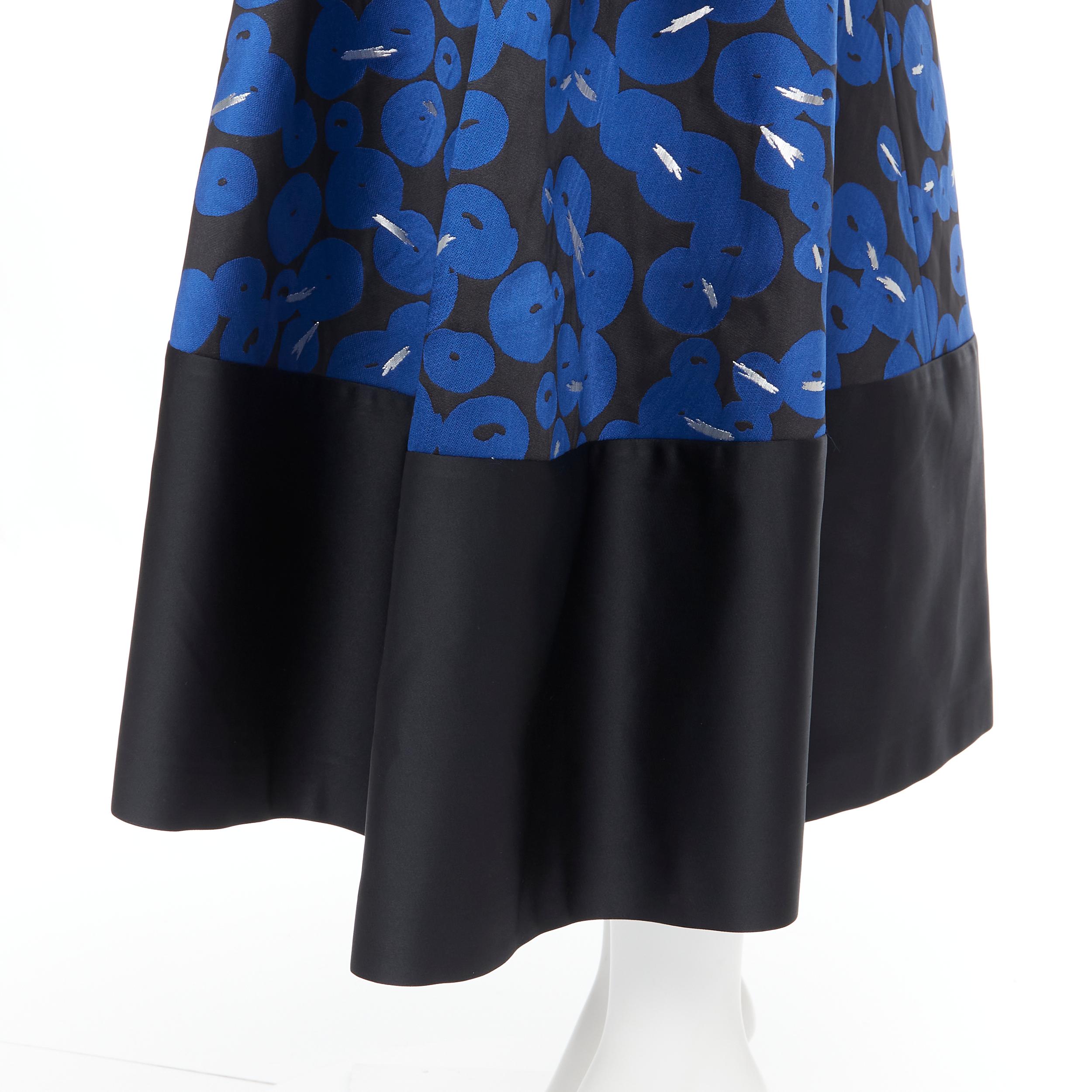 JIL SANDER NAVY blue black silver flared cocktail skirt FR32 XS 
Reference: LNKO/A01752 
Brand: Jil Sander 
Material: Polyester 
Color: Blue 
Pattern: Geometric 
Closure: Zip 
Extra Detail: Dual front pockets along pleat. 
Made in: Italy