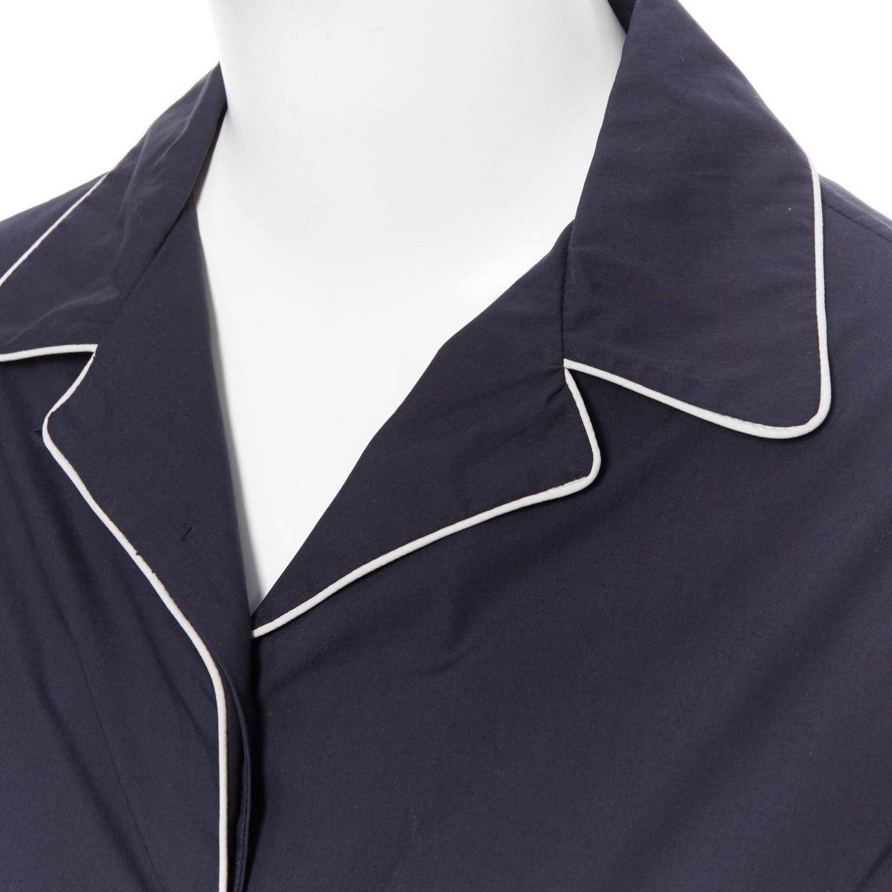 JIL SANDER navy blue cotton cuban shirt notch collar pipe short sleeves FR34
Reference: LNKO/A01135
Brand: Jil Sander
Material: Cotton
Color: Blue
Pattern: Solid
Closure: Button
Extra Details: Cuban shirt. Pyjama style. Notch lapels. White piping.