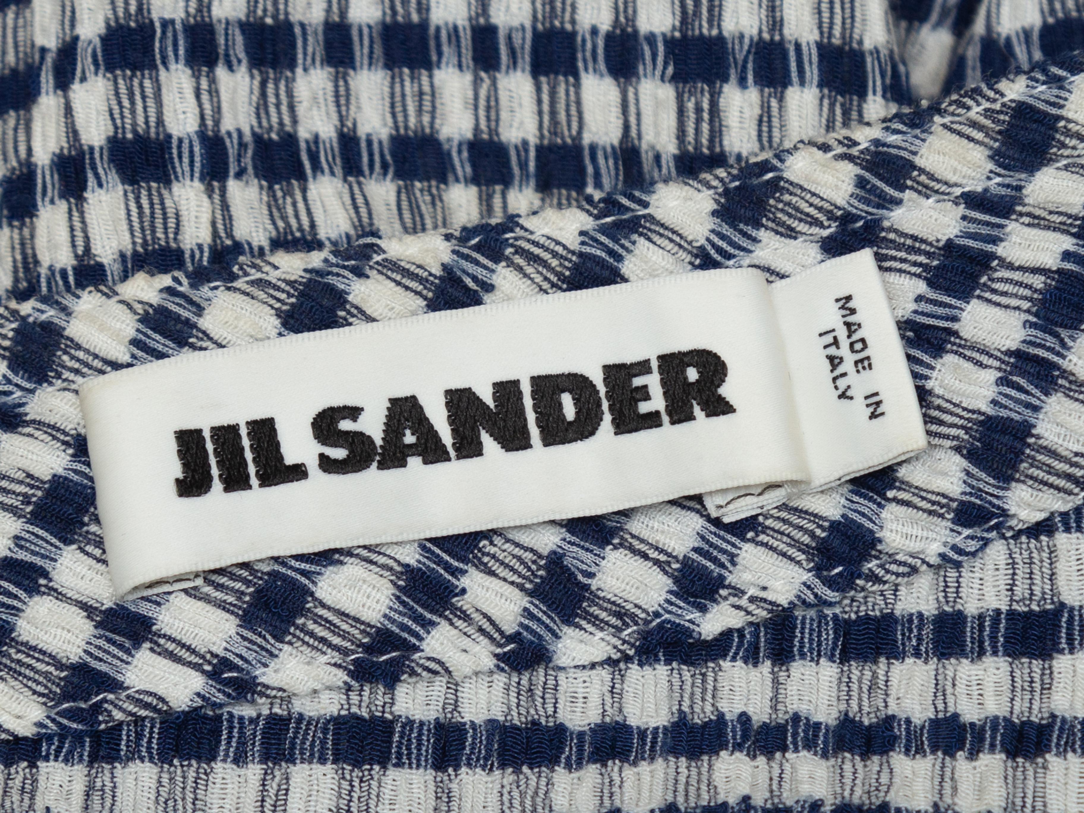 Product details: Navy and white textured gingham midi skirt by Jil Sander. Zip closure at center back. Designer size 40. 34