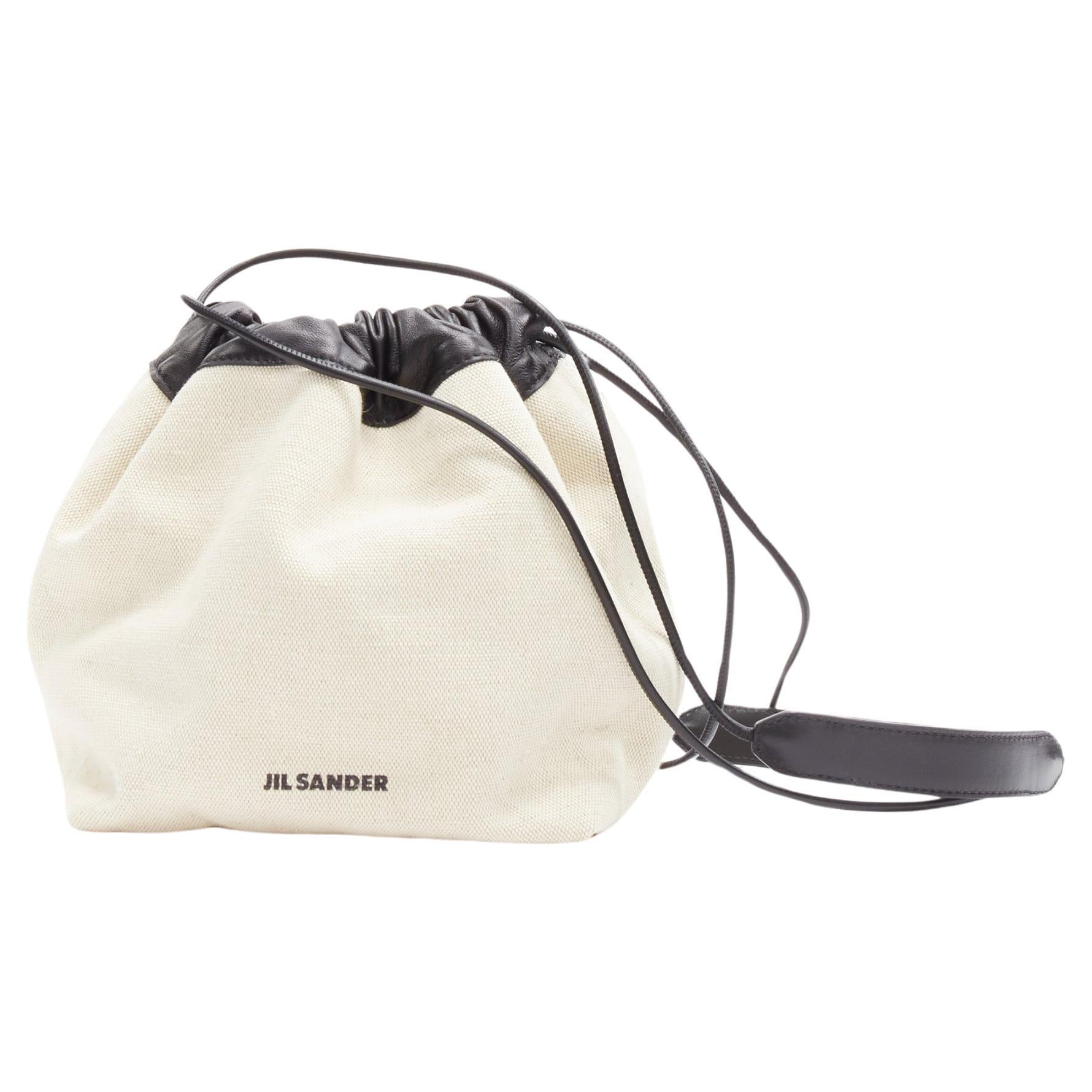 JIL SANDER off white canvas black leather logo drawstring pouch bucket bag