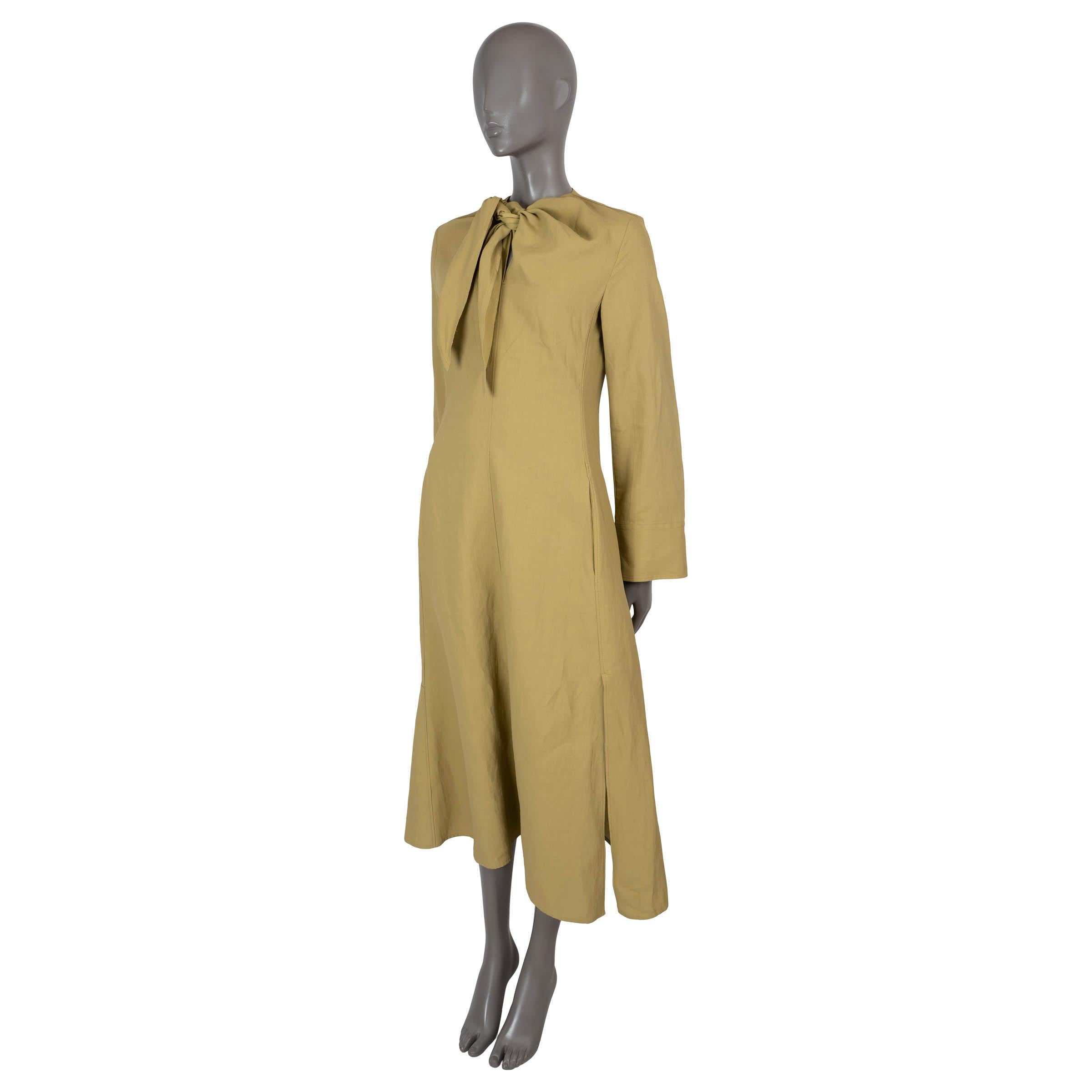 100% authentic Jil Sander midi sheath dress in mustard linen (100%). Features fitted silhouette with tie-neck, long sleeves with buttoned cuffs, two slant pockets at the waist and side slits. Opens with concealed zipper in the back and is unlined.