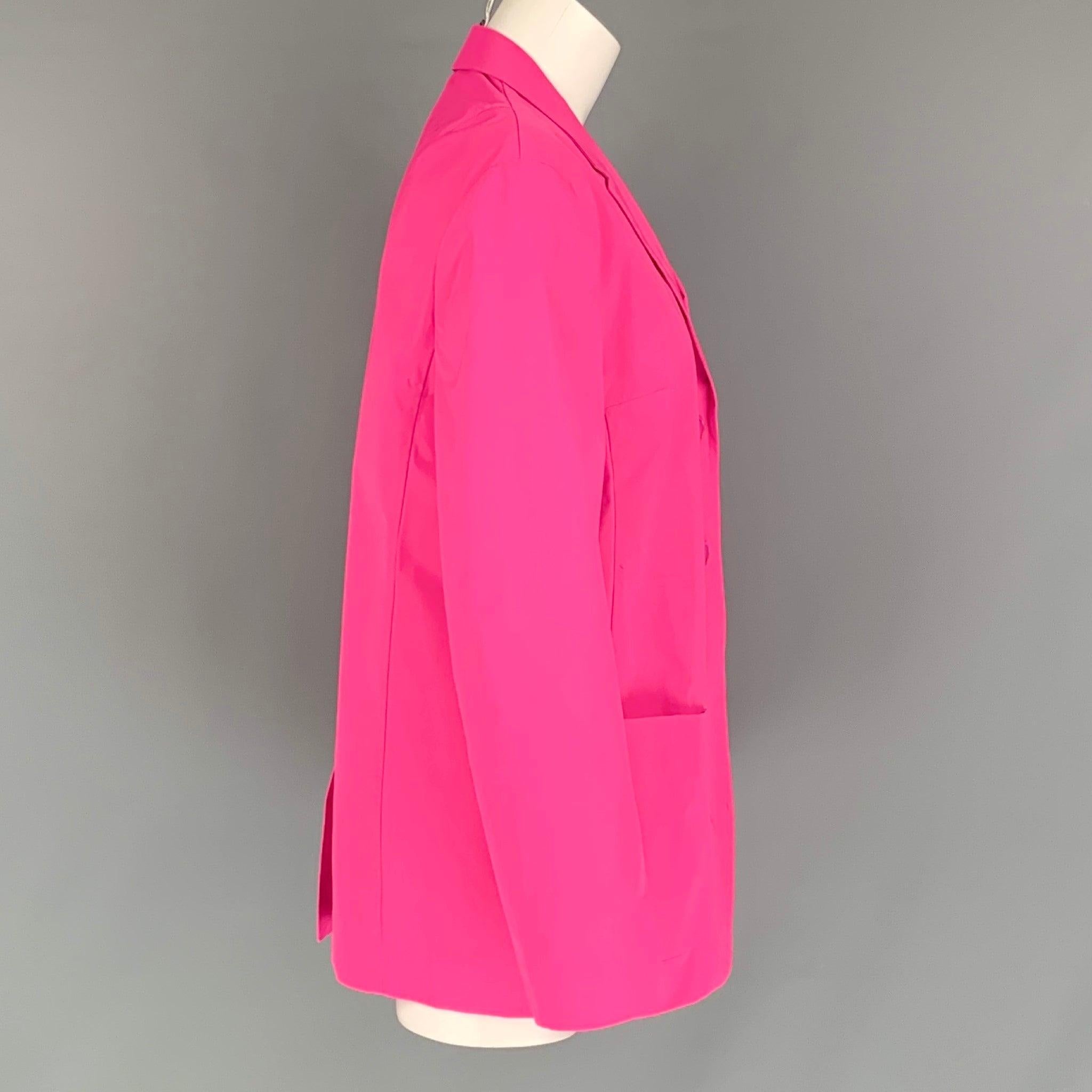JIL SANDER blazer comes in a pink polyester featuring a notch lapel, patch pocket, single back vent, and a double button closure. Made in Italy. Very Good Pre- Owned Condition. Moderate Marks at Back. 

Marked:   38 

Measurements: 
 
Shoulder: 16.5