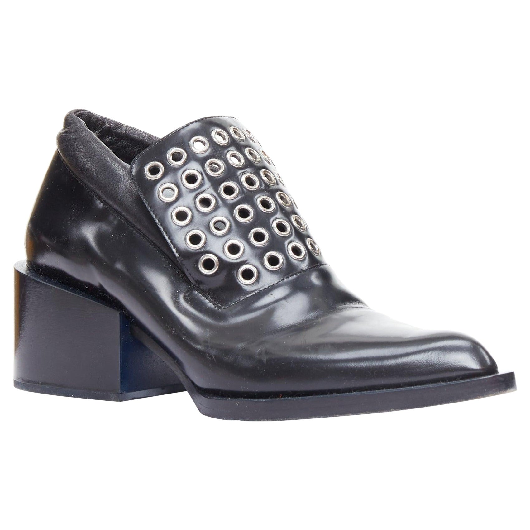 JIL SANDER ojal plateado mocasín con tacón bloque de cuero negro EU38 en venta