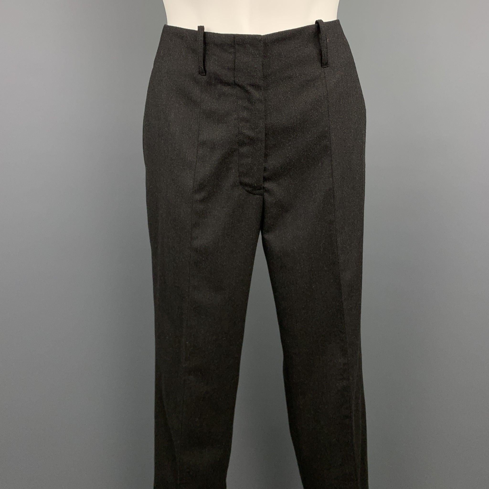 JIL SANDER dress pants comes in a charcoal virgin wool featuring a straight leg, front tab, and a zip fly closure. Made in Italy.
Excellent
Pre-Owned Condition. 

Marked:  IT 32 

Measurements: 
 Waist: 28 inches 
Rise: 8.5 inches 
Inseam: 29 inches