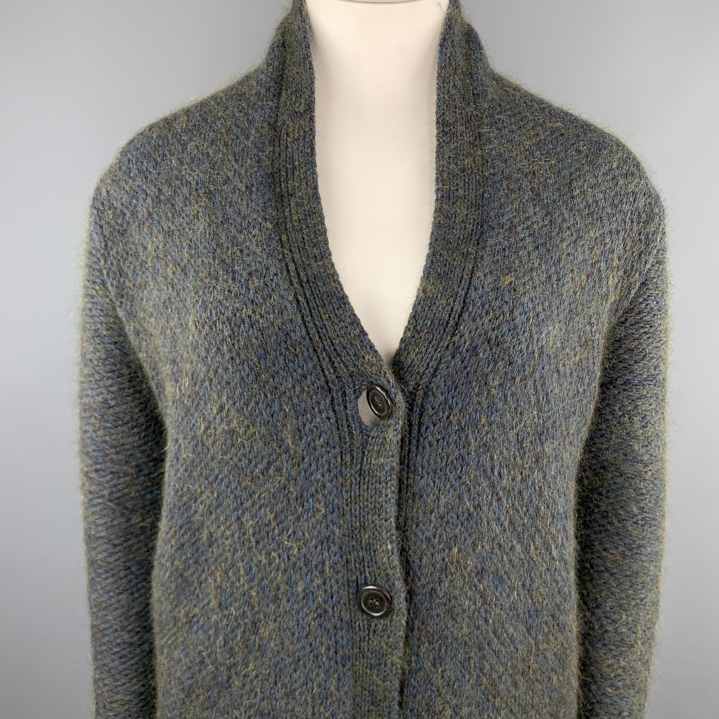 JIL SANDER oversized cardigan comes in a chunky blue and green heathered cashmere blend knit with a V neck, and four button front. Made in Italy.

Excellent  Pre-Owned Condition.
Marked: IT 40

Measurements:

Shoulder: 22 in.
Bust: 46 in.
Sleeve: 26