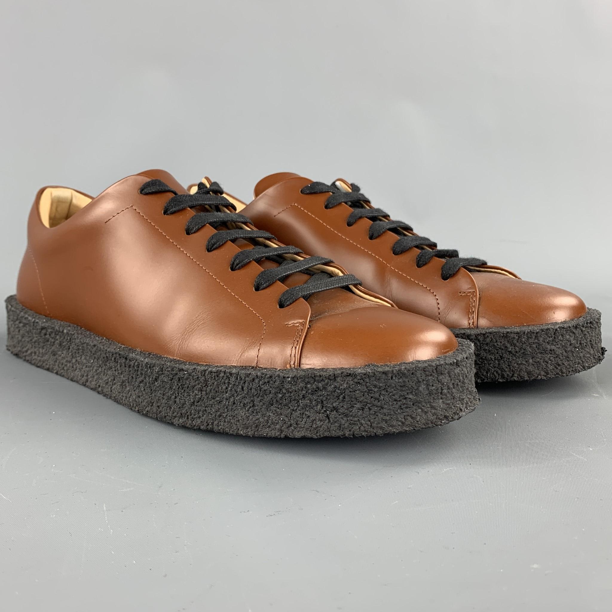 JIL SANDER shoes comes in a whiskey brown leather featuring a rubber sole and a lace up closure. Comes with box. Made in Italy.

Excellent Pre-Owned Condition.
Marked: EU 43

Outsole:

12 in. x 4 in. 