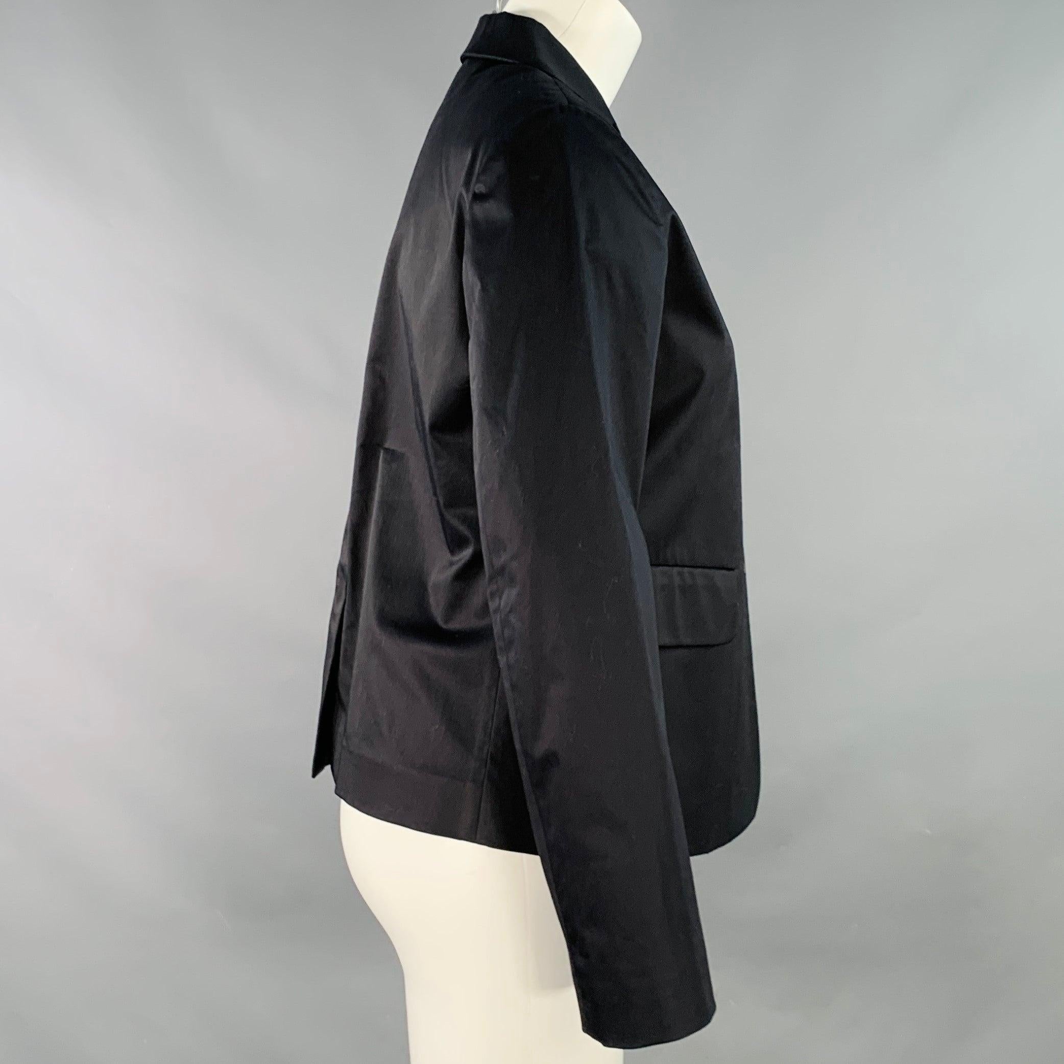 JIL SANDER jacket
in a black cotton stretch blend fabric featuring three pockets (two flap, one slip), long sleeves, and button closure. Made in Italy.Excellent Pre-Owned Condition. 

Marked:   IT 38 

Measurements: 
 
Shoulder: 15 inches Bust: 37