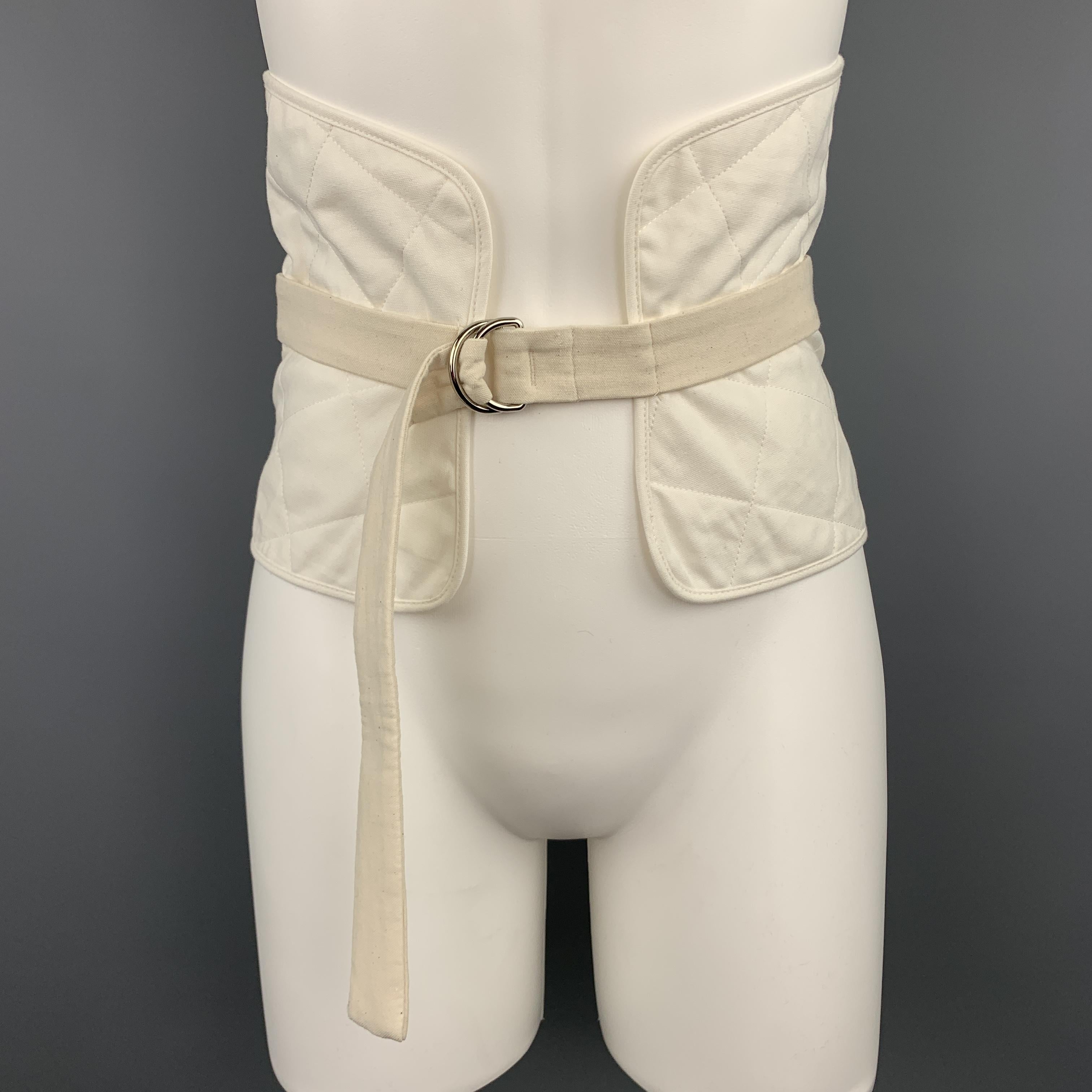 JIL SANDER Resort 2018 waist belt comes features a thick quilted wool mohair blend canvas band with adjustable belt overlay with D loop closures. Made in Italy.

New with Tags.
Marked: IT 38
Original Retail Price: $470.00

Measurements:

Length: 40