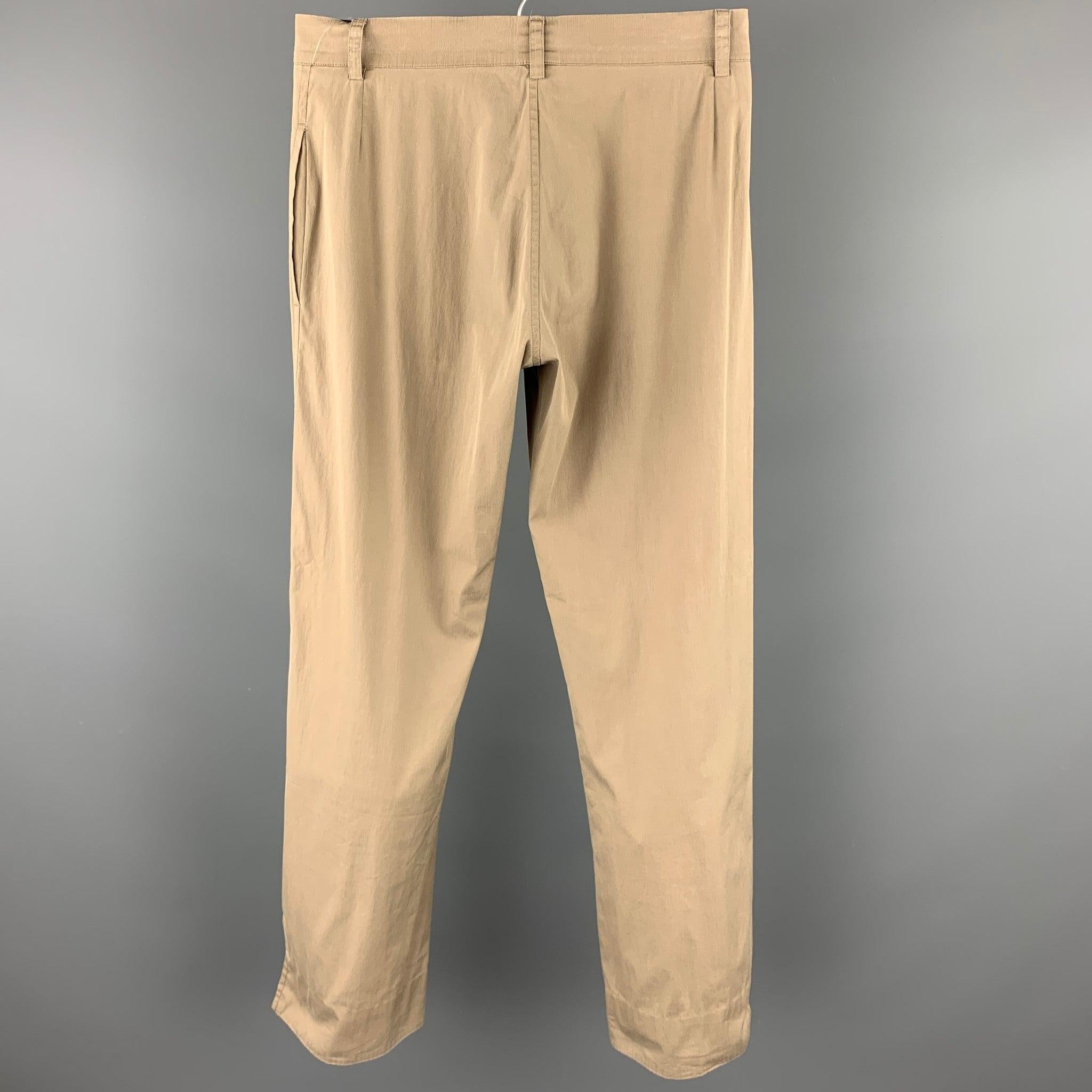 JIL SANDER dress pants in a taupe cotton stretch blend featuring a straight leg and a zip fly closure. Made in Italy.
Very Good
Pre-Owned Condition. 

Marked:   32 

Measurements: 
  Waist: 28 inches 
Rise: 9 inches 
Inseam: 29 inches 

  
  
 
Sui