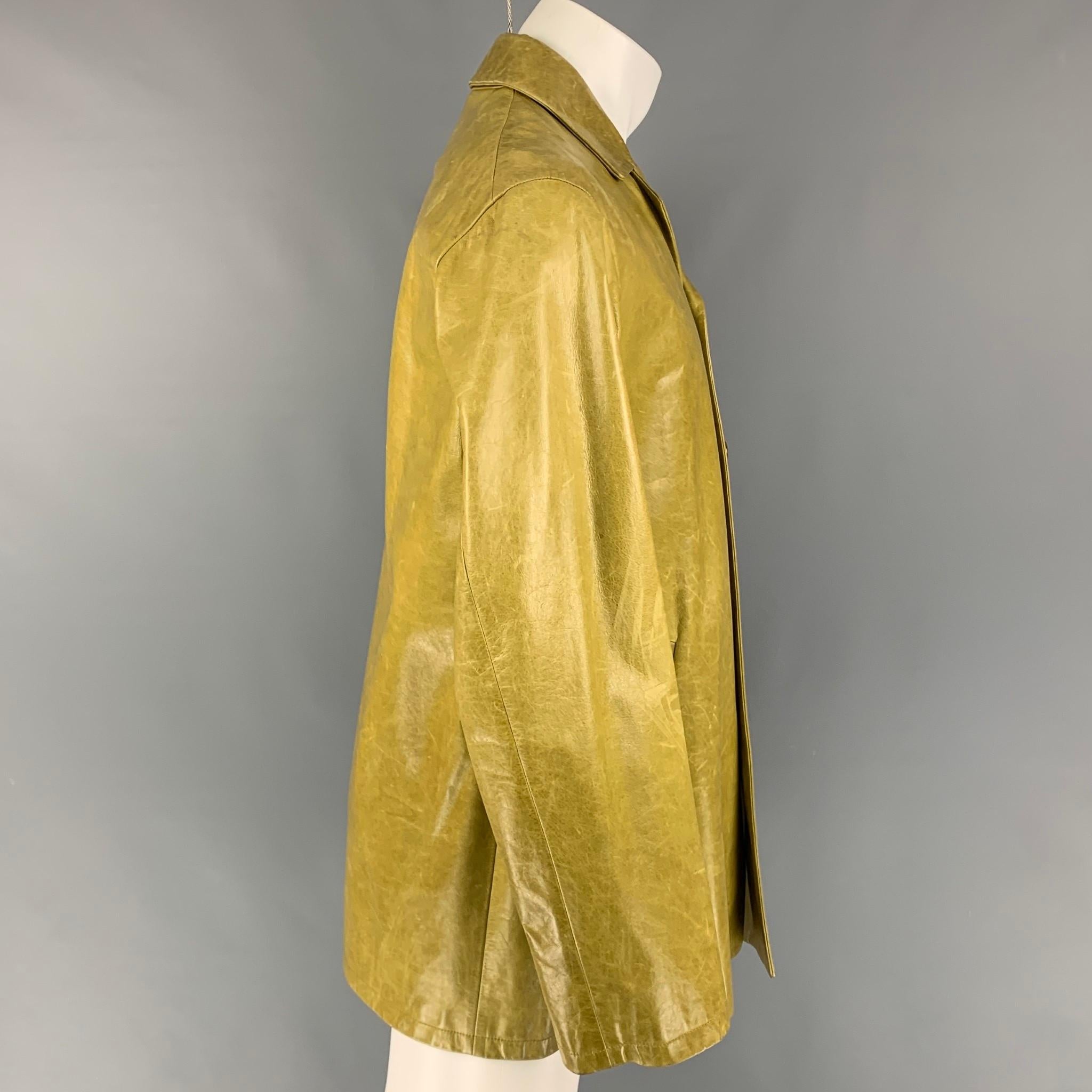 JIL SANDER coat comes in a chartreuse distressed leather with a full liner featuring a notch lapel, slit pockets, and a buttoned closure. Made in Italy.

Very Good Pre-Owned Condition.
Marked: 46

Measurements:

Shoulder: 18 in.
Chest: 44
