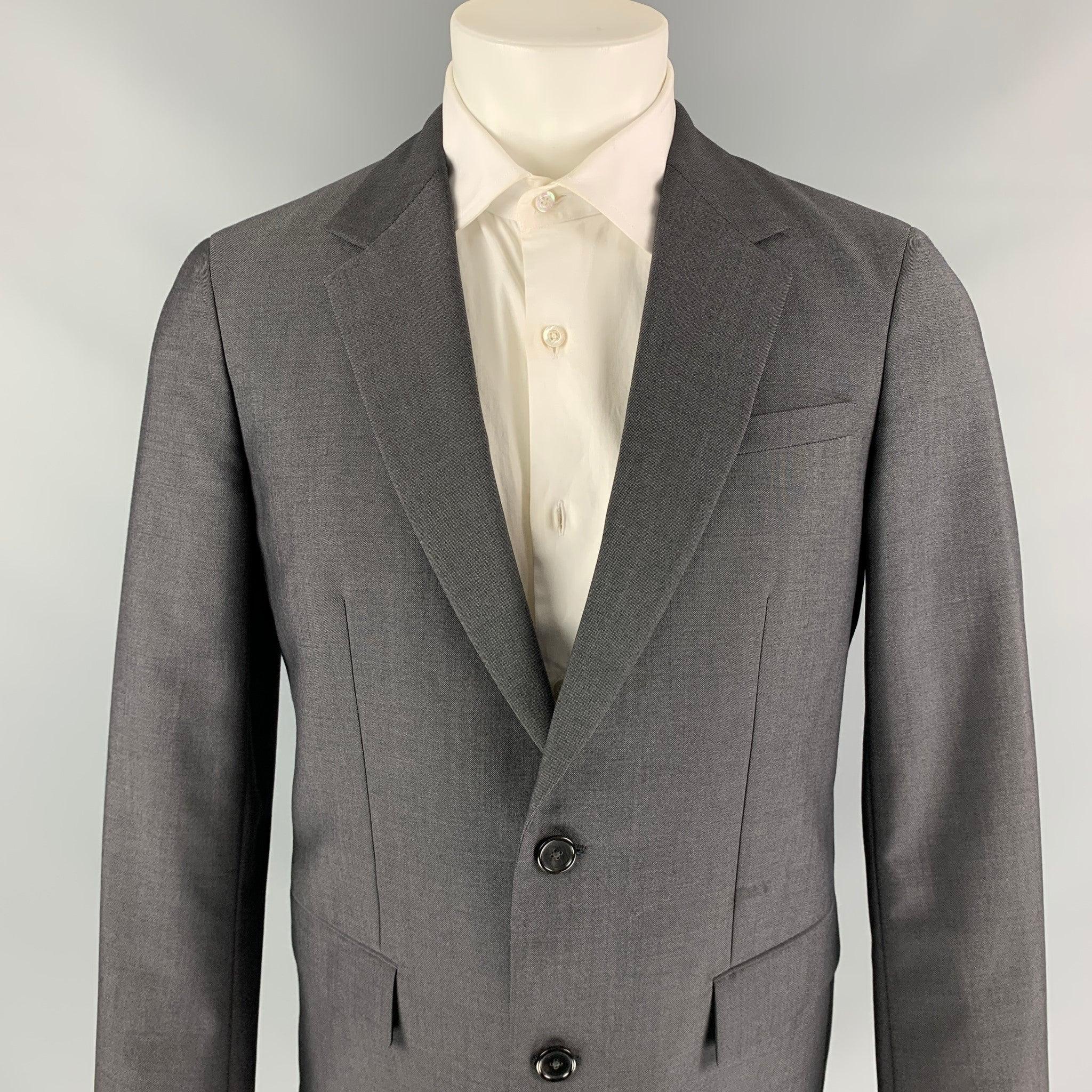 JIL SANDER sport coat comes in a dark gray wool / mohair with a full liner featuring notch lapel, flap pockets, and a two button closure. Made in Italy.Very Good
Pre-Owned Condition. 

Marked:   48 

Measurements: 
 
Shoulder: 17.5 inches  Chest: 40