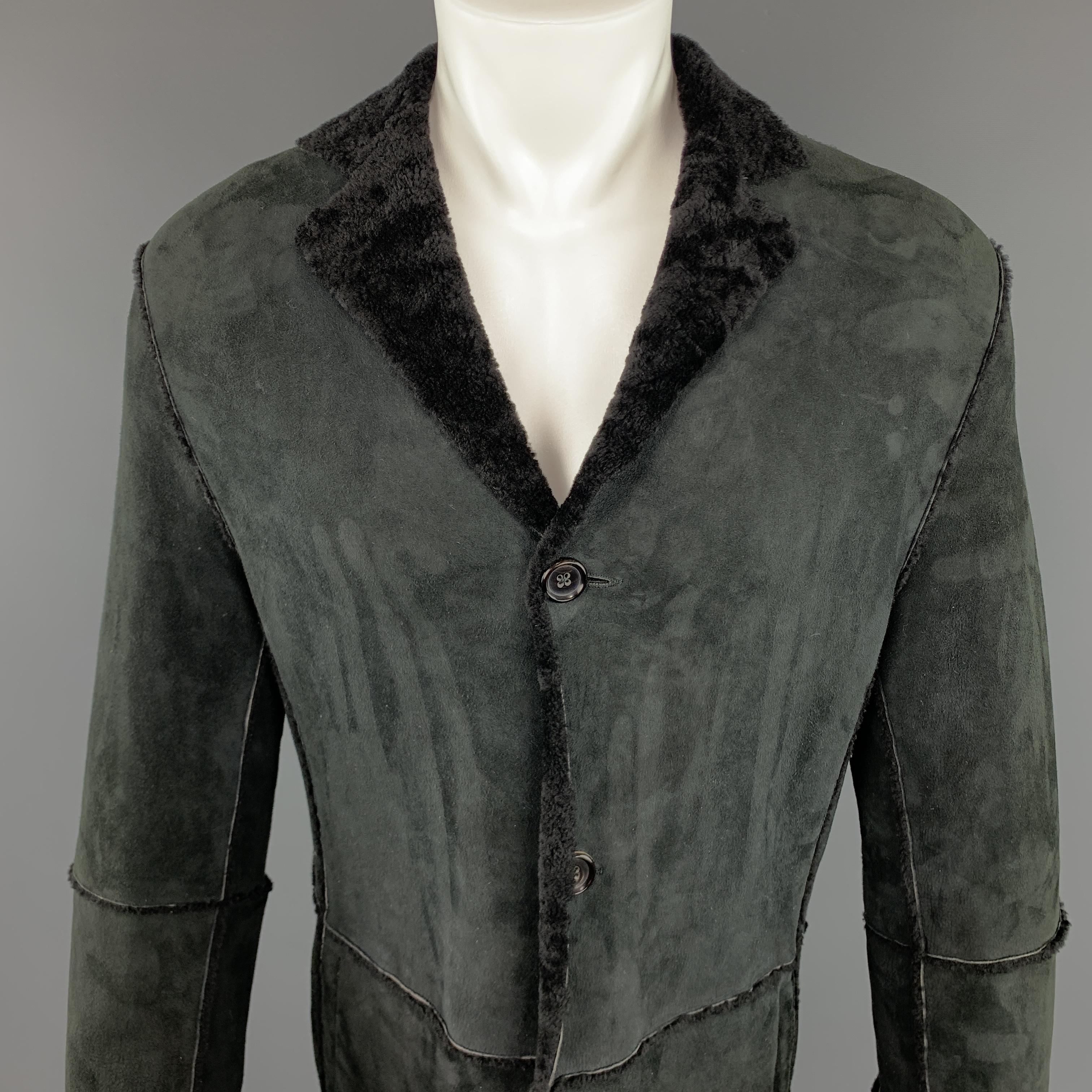 JIL SANDER Long Coat comes in a black tone in a lamb shearling material, with a notch lapel, four buttons at closure, single breasted, slit pockets, and a single vent at back. Made in Italy.

Excellent Pre-Owned Condition.
Marked: IT